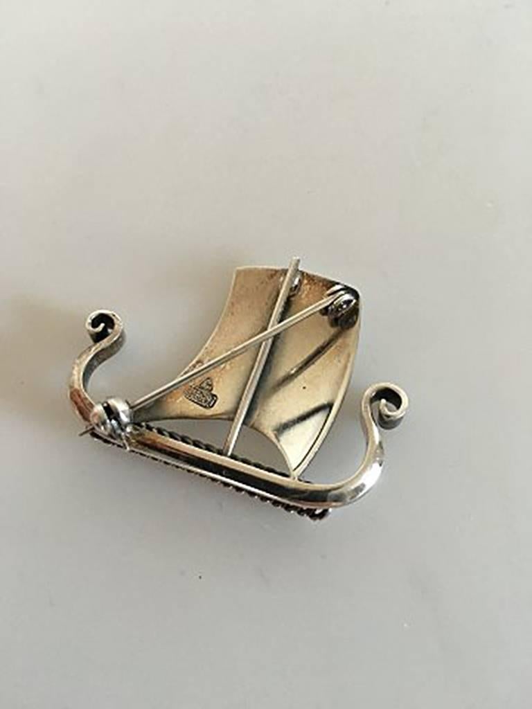 Anton Michelsen Sterling Silver Brooch Viking Ship. Measures 3.5 cm / 1 3/8 in. Weighs 7.8 g / 0.27 oz. Is in perfect condition.