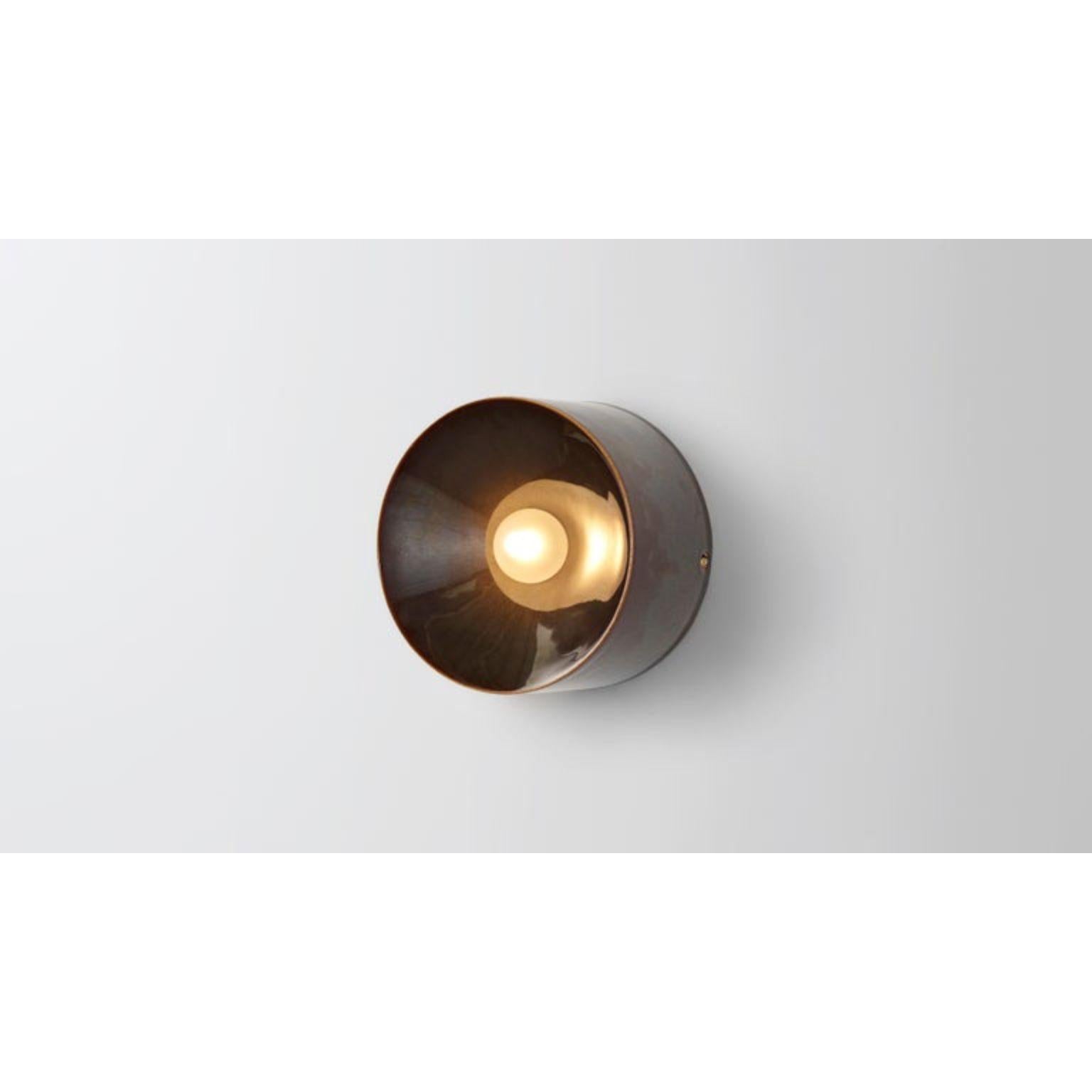 Anton mini in brown ceramic by Volker Haug.
Anton series
Dimensions: W 13, H 13, D 8.3 cm
Materials: Cast ceramic
Glaze: Brown
Lamp: G9 LED (240V / 120V US). 12V option available
Glass bulb: 4.5 cm Ø, Frosted
Weight: 1kg

Anton Mini (Ø13