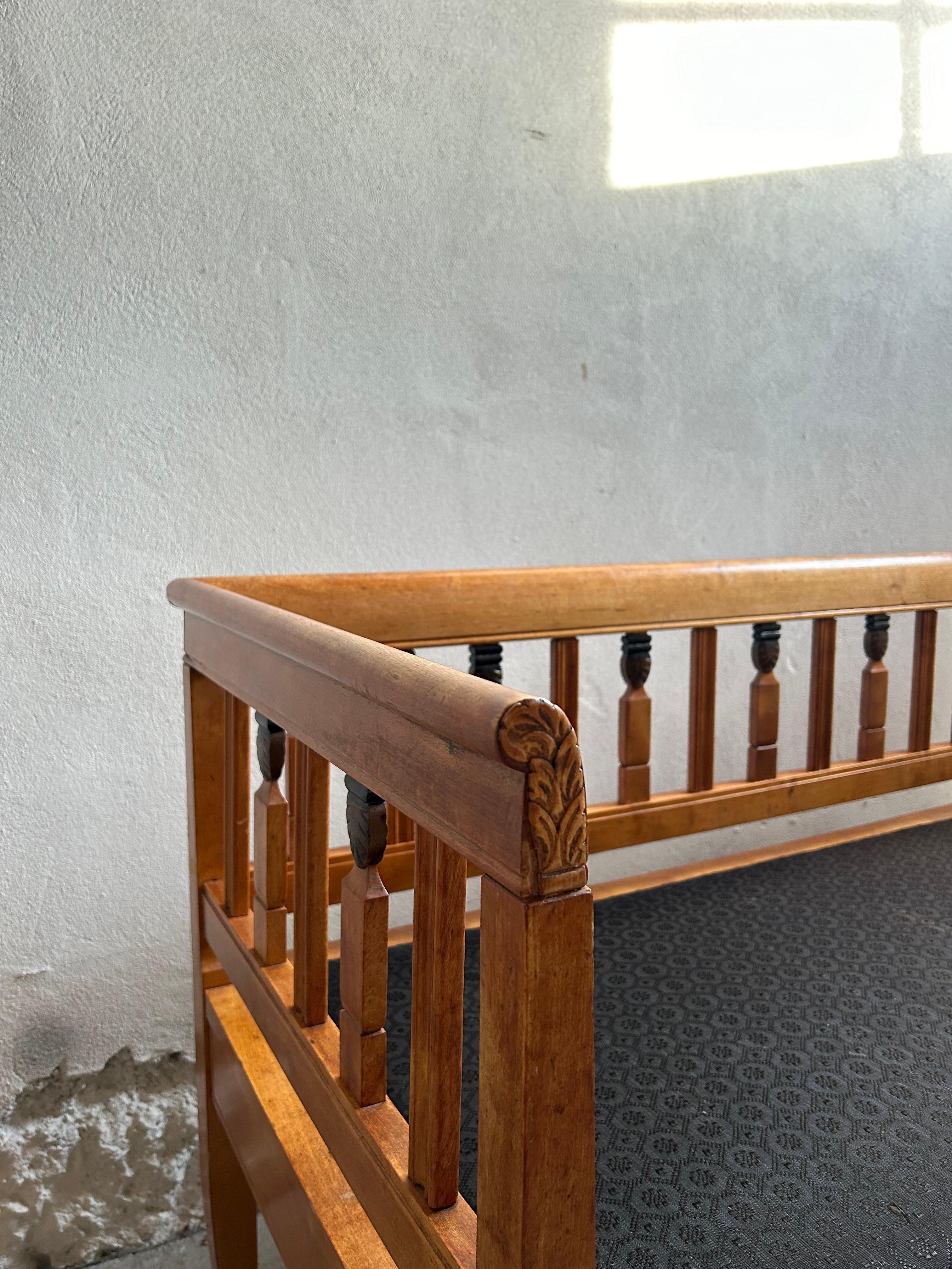 A rare and remarkable bench designed by celebrated Danish architect and designer Anton Rosen, crafted around 1905. This exquisite piece features a birchwood frame with elegant black-painted details, showcasing Rosen’s signature blend of Art Nouveau