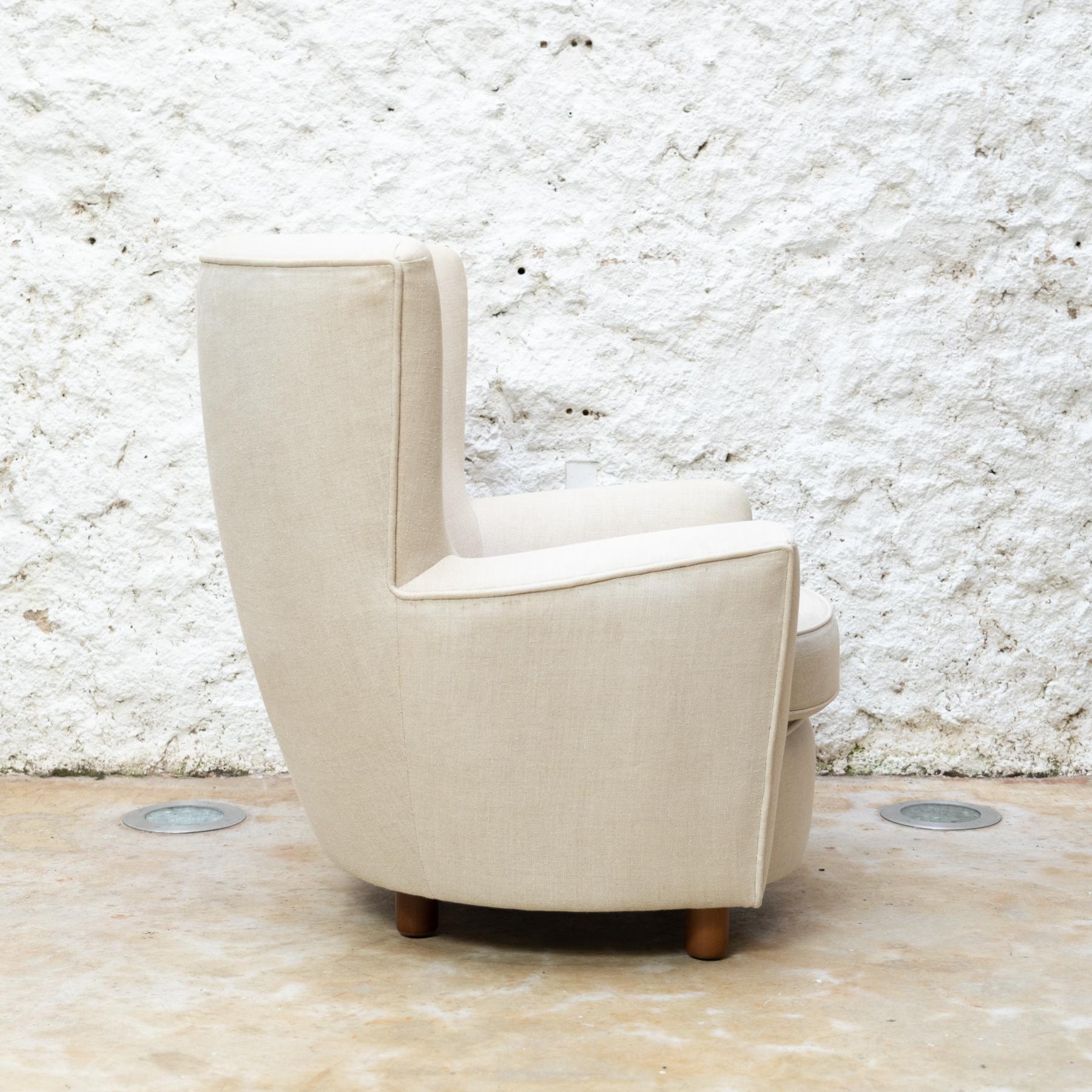 Armchair and Footstool designed by Antoni de Moragas
Manufactured by Santa & Cole, Spain in 1997.

In original condition, with minor wear consistent of age and use, preserving a beautiful patina.