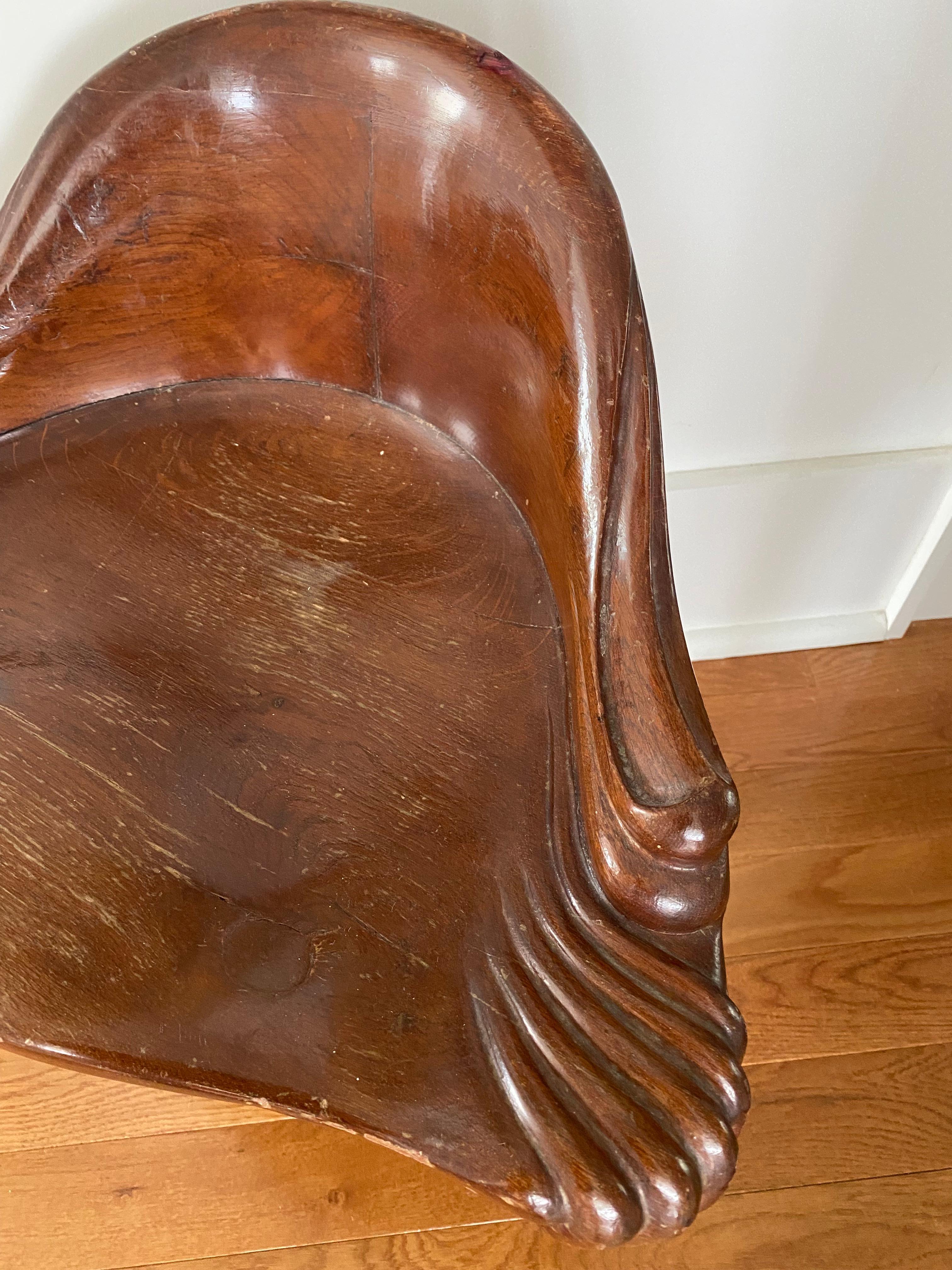 Corner chair by Antoni Gaudi for Casa Calvet during Barcelona's Art Nouveau period. Designed in during the turn of the 20th century 1898-1900.

BD Barcelona has re edited Gaudi furnishings since the 1970s.

Heavy solid wood - mahogany.