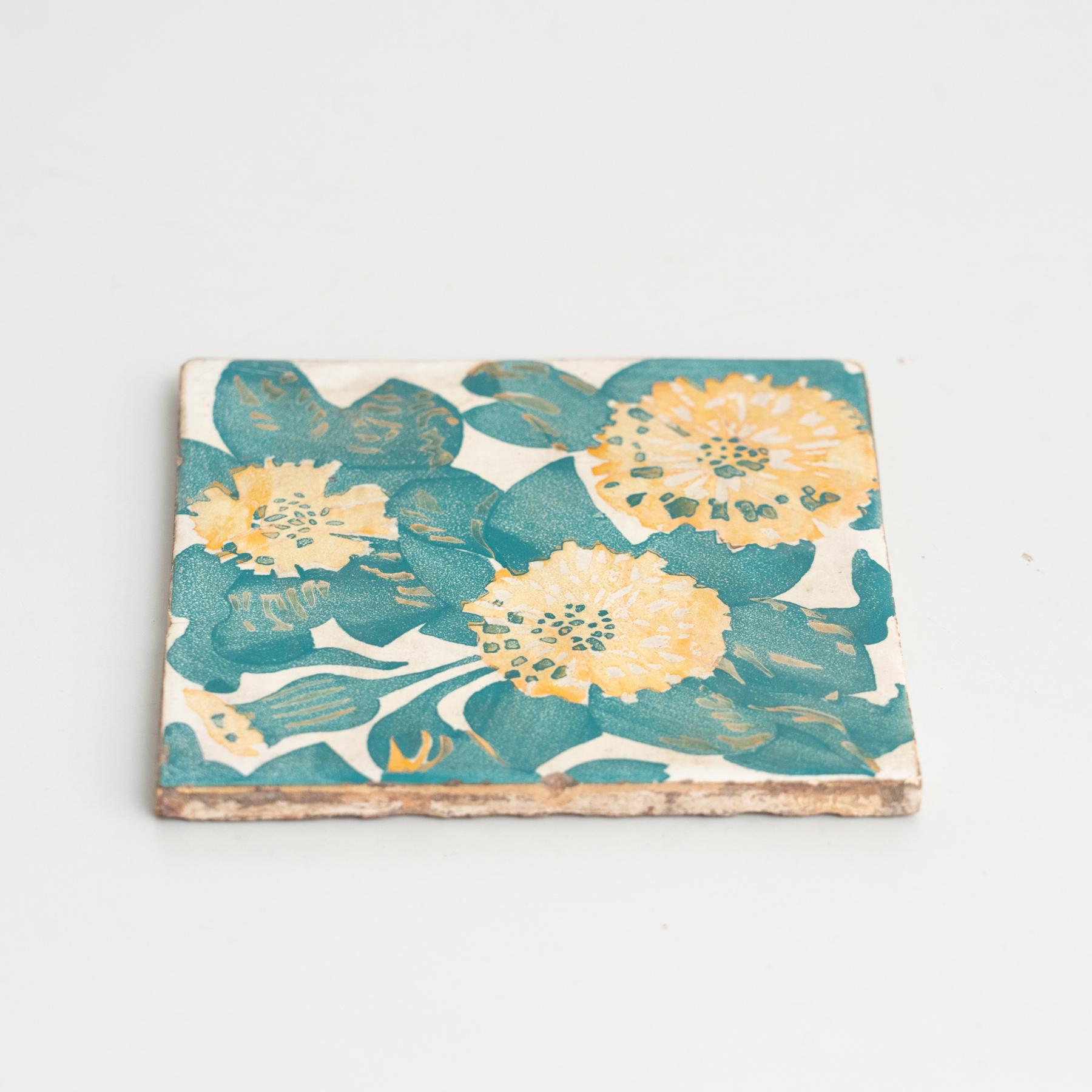 Decorative ceramic tile by Antoni Gaudi, inspired by the marigold and dianthus motifs on the decorative ceramic tiles he designed for the facade of Casa Vicens, which constitute some of its most iconic features.

In good original condition, with