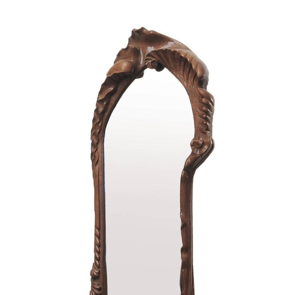 Mirror designed by Antoni Gaudi, circa 1902.
Manufactured by BD Furniture in Barcelona.

Solid oak, varnished. 
There is also the same model covered in fine gold leaf. 

Measure: 58cm x 195cm

Year of design: 1902

Production lead time: