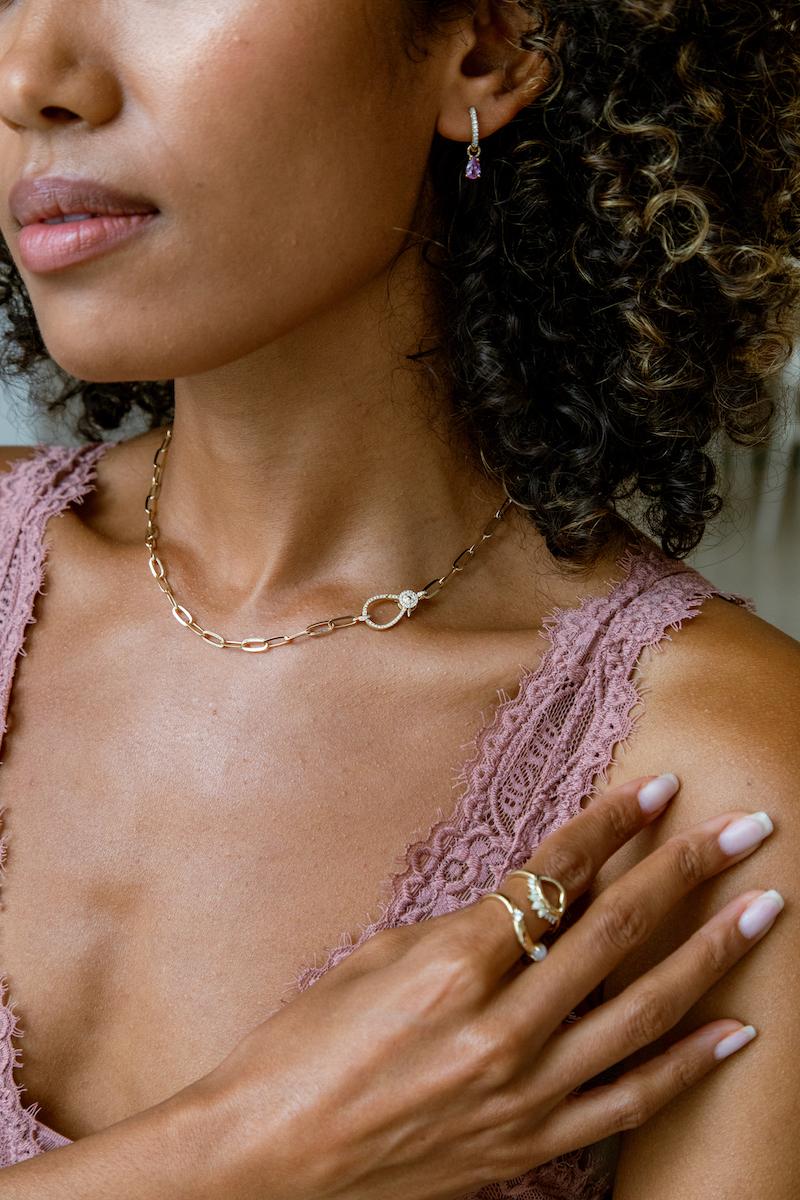An elegant take on the popular link chain style, this uniquely designed 16 inch 14k solid gold paperclip chain necklace with diamond encrusted lobster claw clasp wears beautifully in multiple ways. Timeless and of the moment all in one, layer the