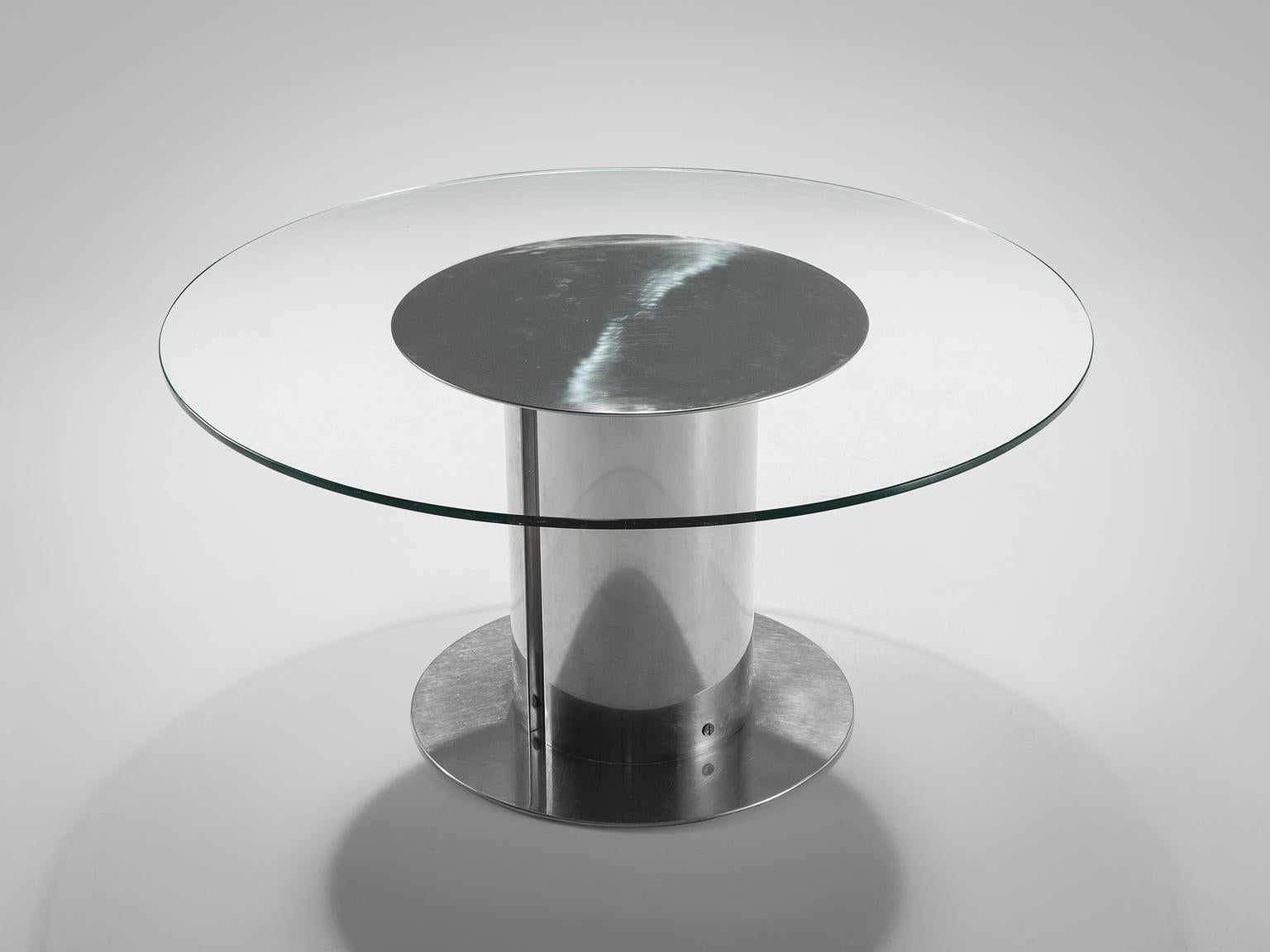 Antonia Astori for Cidue, Cidonio dining table, chromed metal, glass, Italy, ca. 1968.

This postmodern centre table with chromed industrial foot features a circular glass top and a brushed chromed metal base. The table is designed for Cidue and
