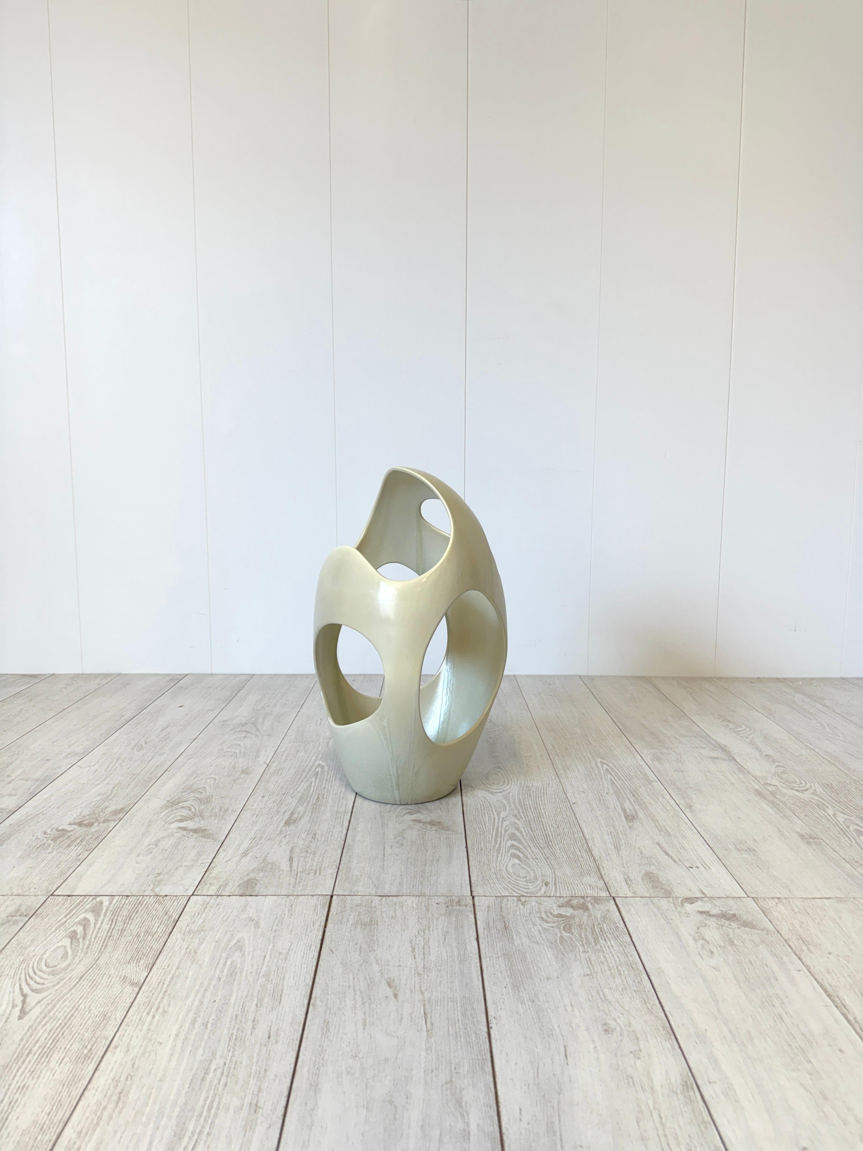 Peculiar umbrella stand made of strong single-fired cast ceramic, glazed in white. 
Manufacture mark under the base.