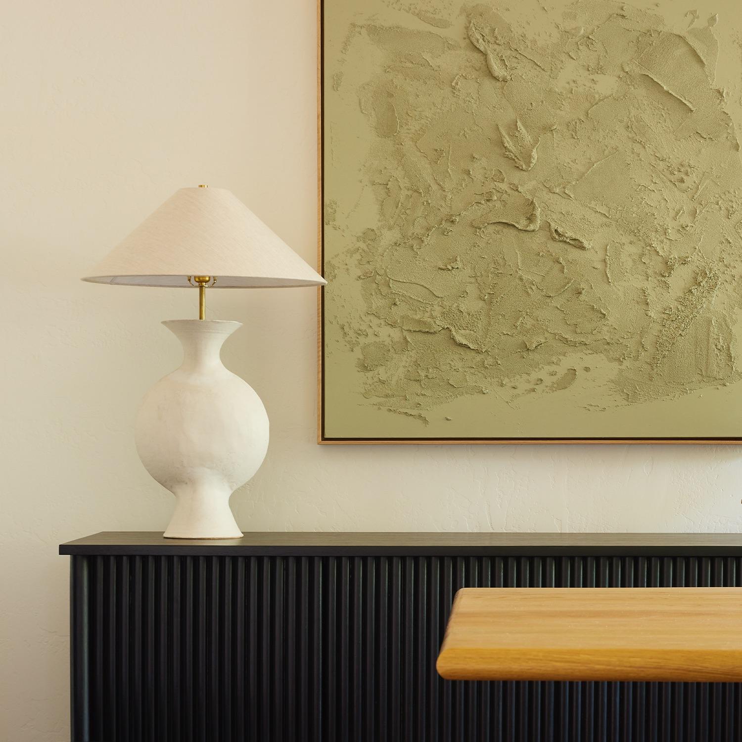 The Antonia lamp is handmade studio pottery by ceramic artist by Danny Kaplan. Shade included. Please note dimensions may vary up to an inch.

Born in New York City and raised in Aix-en-Provence, France, Danny Kaplan’s passion for ceramics was