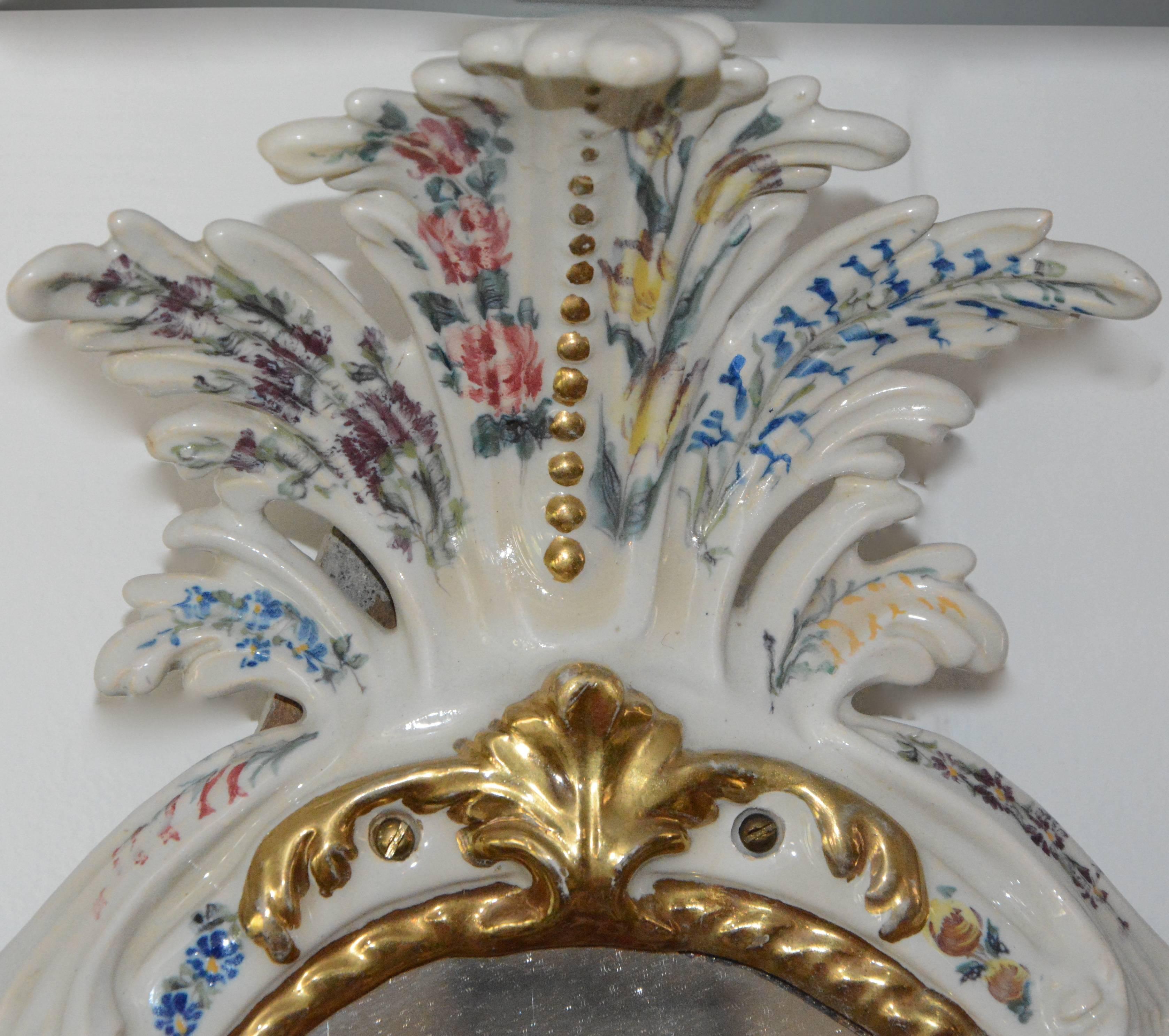 Amazing pair of porcelain hand painted mirrors. The manufactory is the Antonibon located in Nove in the vicinity of Bassano. The period of the two mirrors must be recalled between 1800 and 1880. The mirrors have unique satin etching and copper wheel