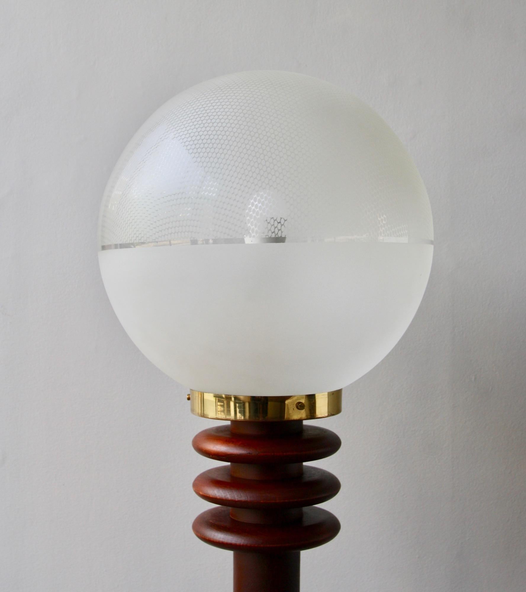 A large vintage Czech floor or table light in turned wood and mouth-blown etched glass, designed and made by Antonín Hepnar, circa 1975.
The materials traditionally associated with the Czech Republic are glass and porcelain. However, Hepar has