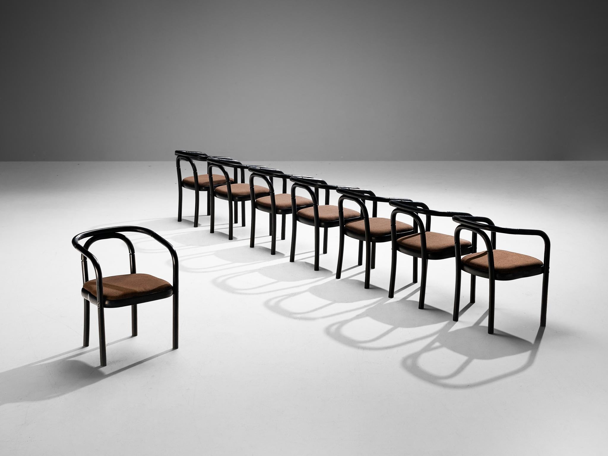 Antonin Suman for TON, set of eight armchairs, model E4309, lacquered wood, fabric, Czech Republic, 1977

A set of eight dining chairs that were designed by Antonin Suman and manufactured by TON. These chairs feature a wonderful bentwood frame