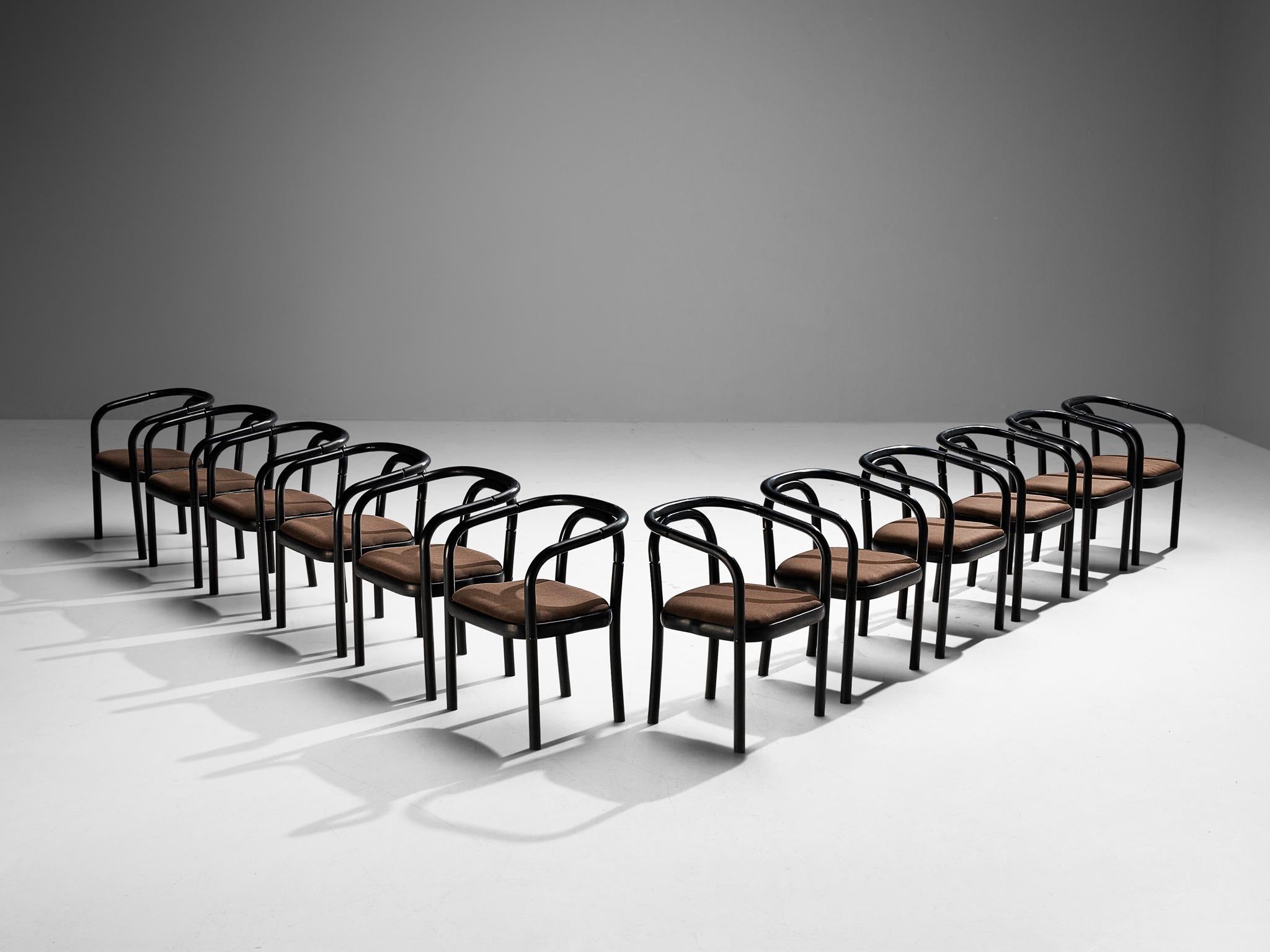 Antonin Suman for TON, set of twelve armchairs, model E4309, lacquered wood, fabric, Czech Republic, 1977

A set of twelve dining chairs that were designed by Antonin Suman and manufactured by TON. These chairs feature a wonderful bentwood frame