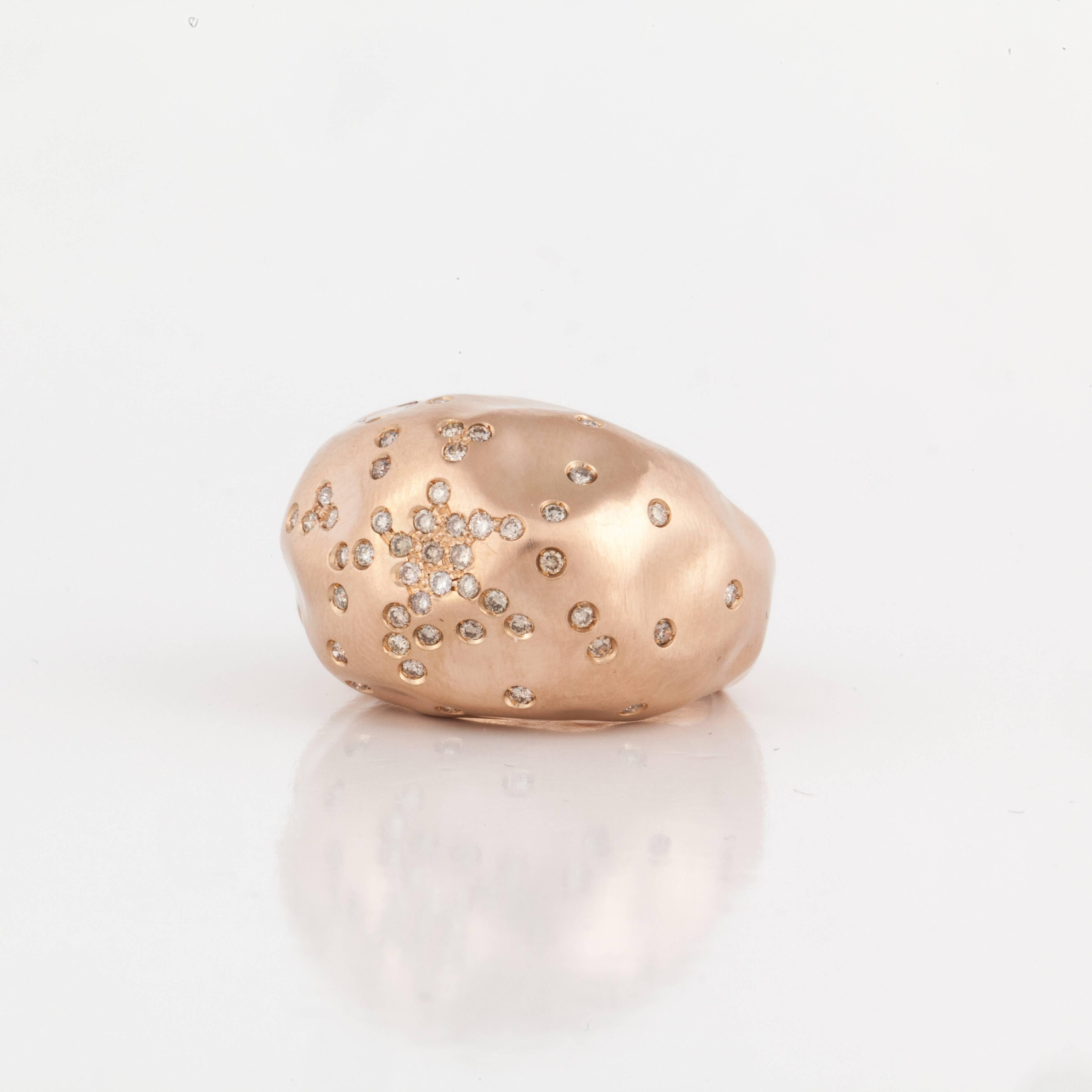 Antonini dome ring in 18K rose gold sprinkled with diamonds.  Marked on the inside 