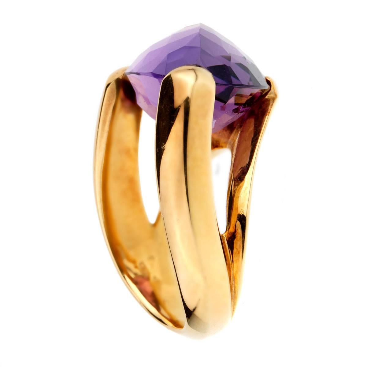 A stunning Antonini ring featuring a checkered cut Amethyst held by 3 prongs in 18k yellow gold. The ring measures a size 6 1/2 and can be resized.