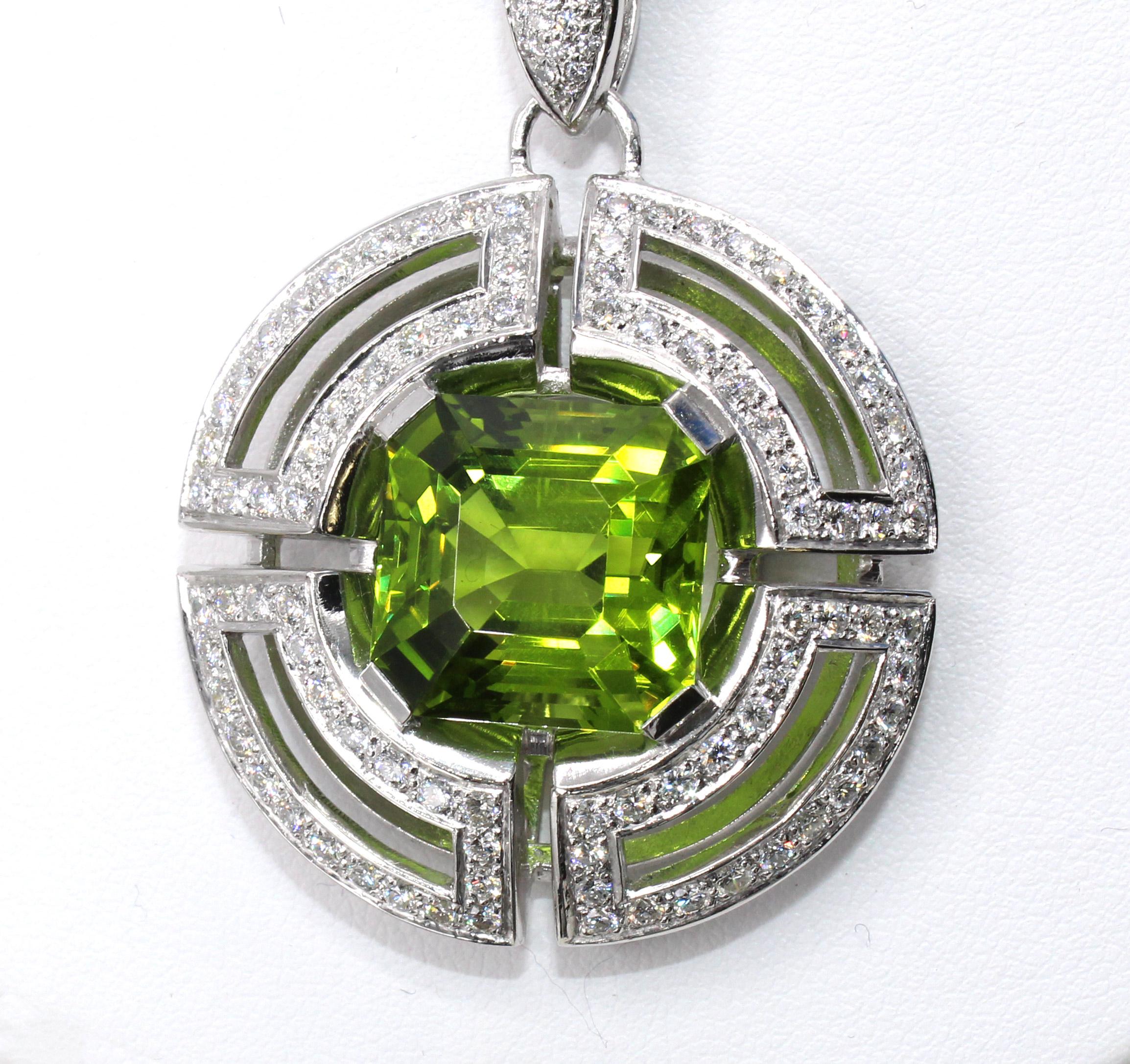 A unique Asscher Cut gem quality Peridot weighing over 20 carats is the center piece of this beautifully designed and masterfully handcrafted pendant necklace by the renown Italian jewelry house Antonini. The Peridot has an amazing saturation of