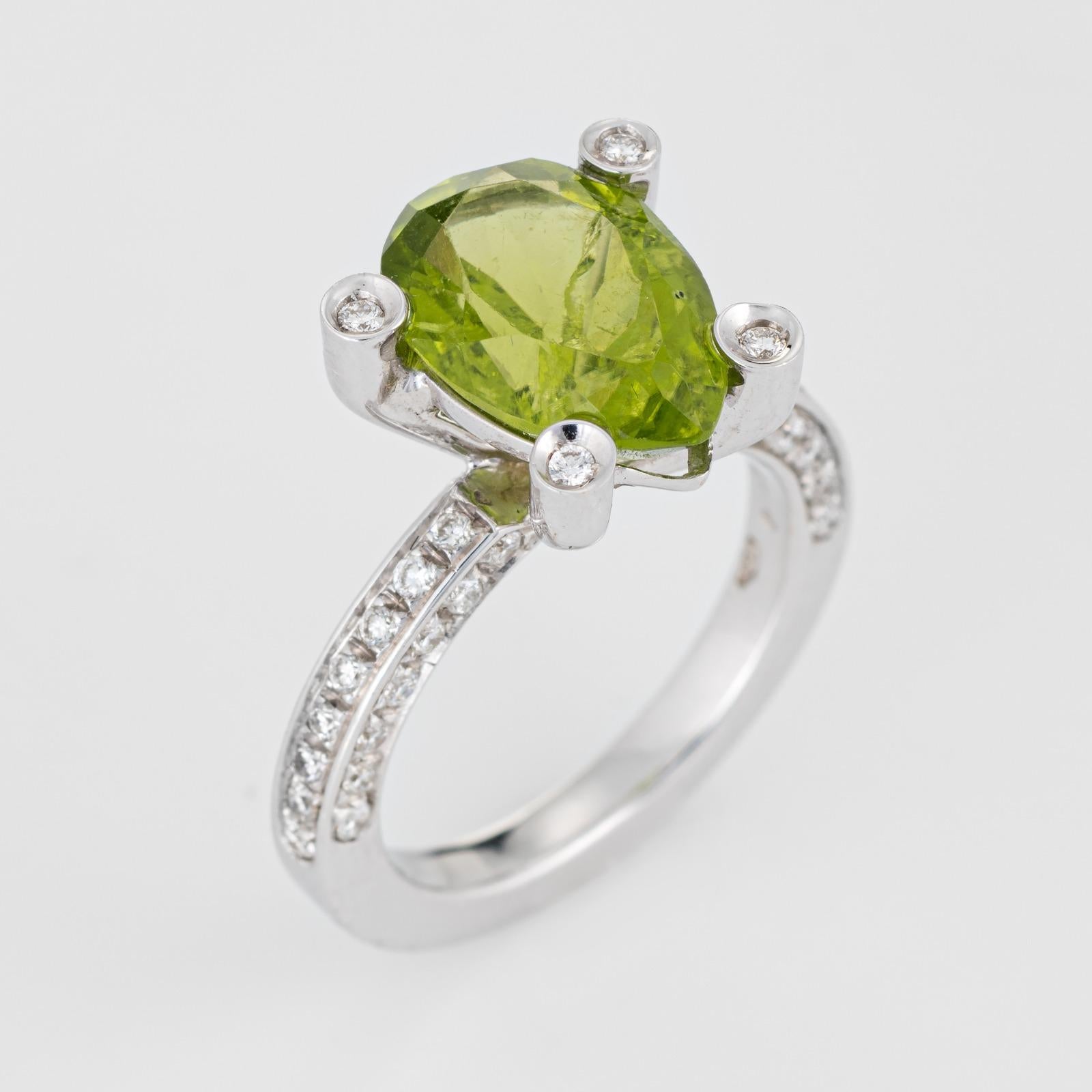 Stylish Antonini peridot & diamond cocktail ring, crafted in 18 karat white gold. 

Peridot is estimated at 3 carats, accented with an estimated 0.50 carats of diamonds (estimated at H-I color and VS2-SI1 clarity). The peridot is in very good