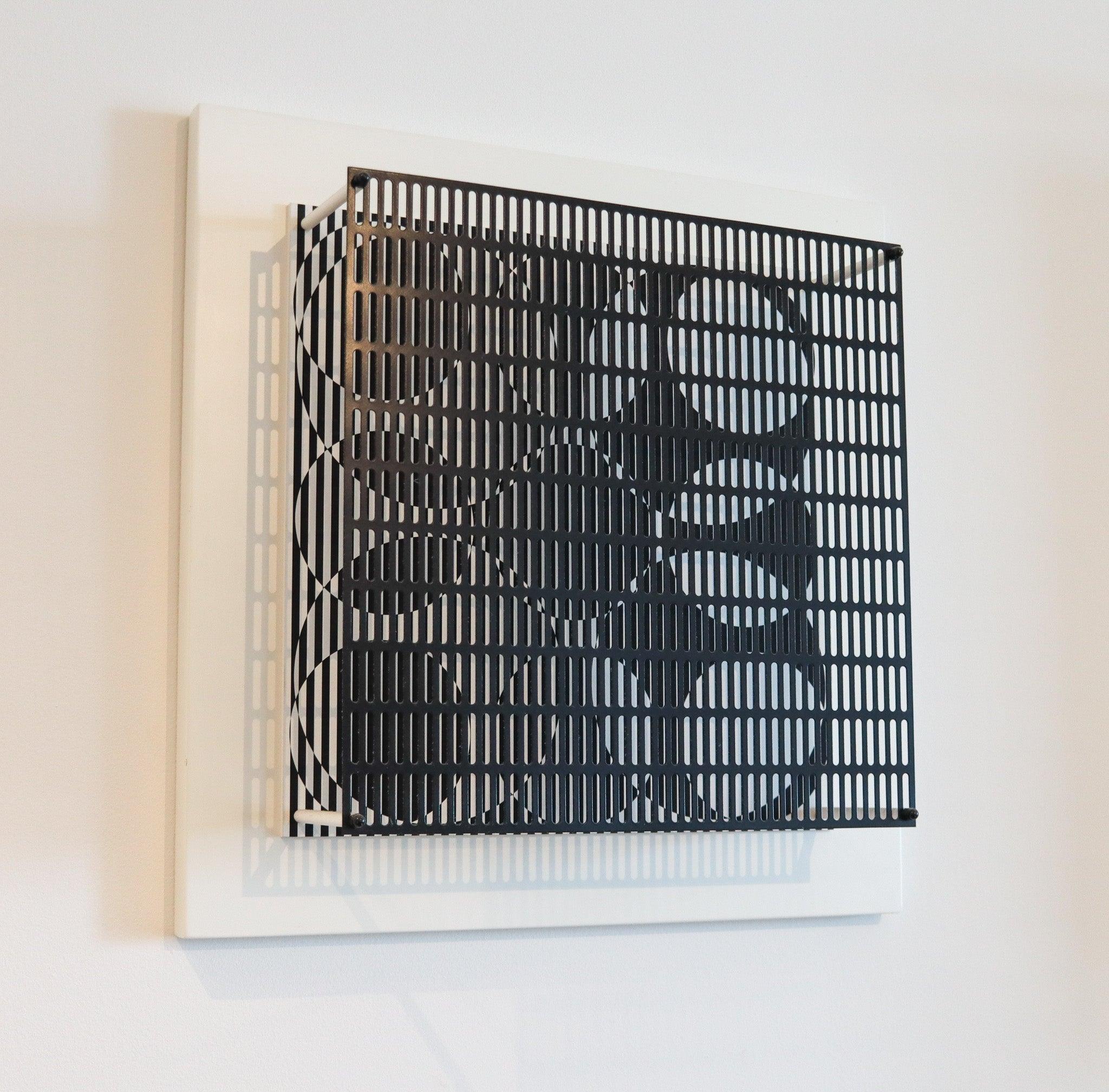 An op-art wall sculpture created by Antonio Asis.

This an amazing art piece created by the Argentinian op-art artist Antonio Asis. Made in a very limited edition of only fifteen pieces. He was an abstract kinetic artist Antonio Asis lives and works