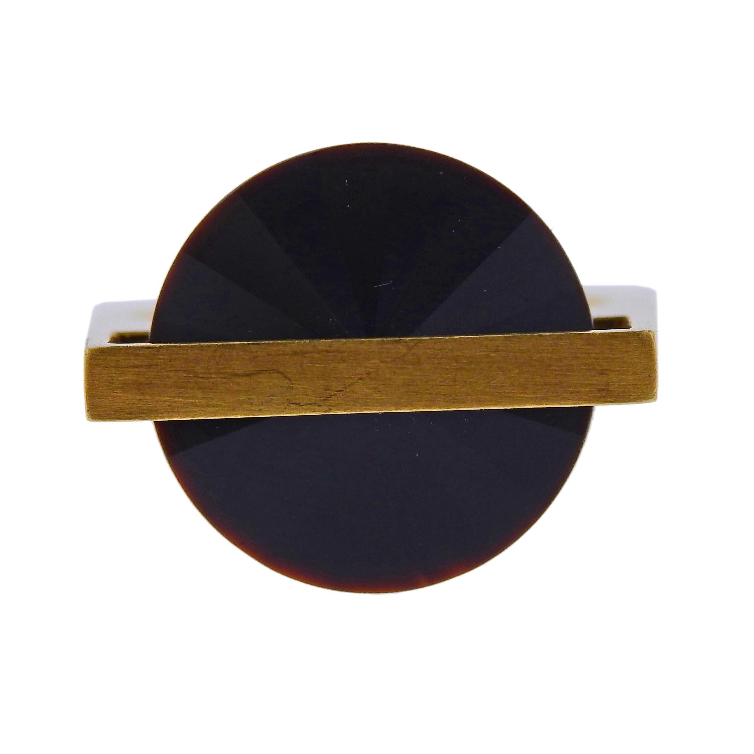 18k yellow gold geometric ring, crafted by Antonio Bernardo, featuring 15mm black gemstone. Ring size - 6.75 and weighs 7.8 grams. Marked Maker's symbol mark, 750.