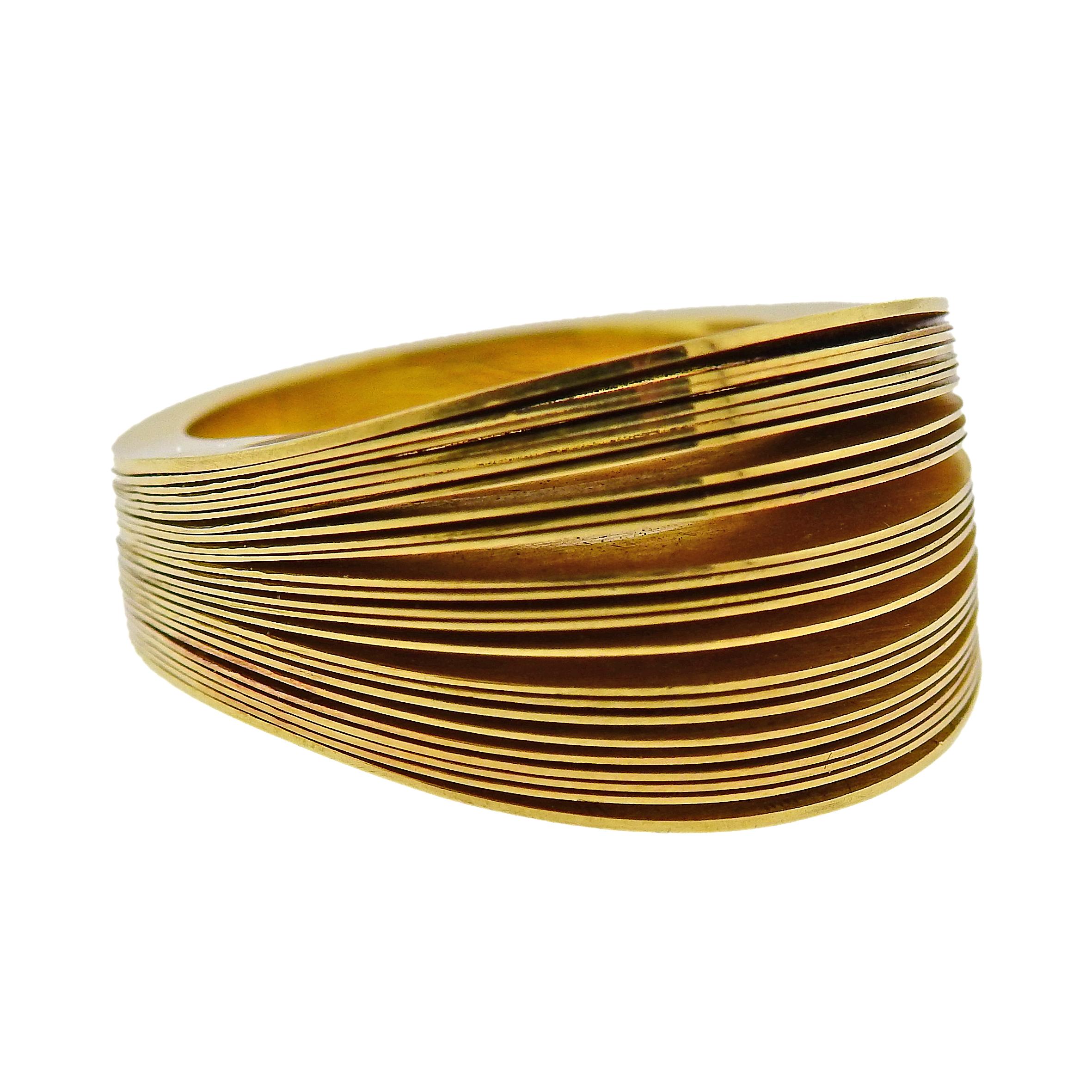 18k yellow gold ring by Antonio Bernardo, featuring layered 18k gold ring. Ring size - 5.75, ring top is 15mm wide. Marked: 750, Maker's mark. Weight: 21.5 grams.