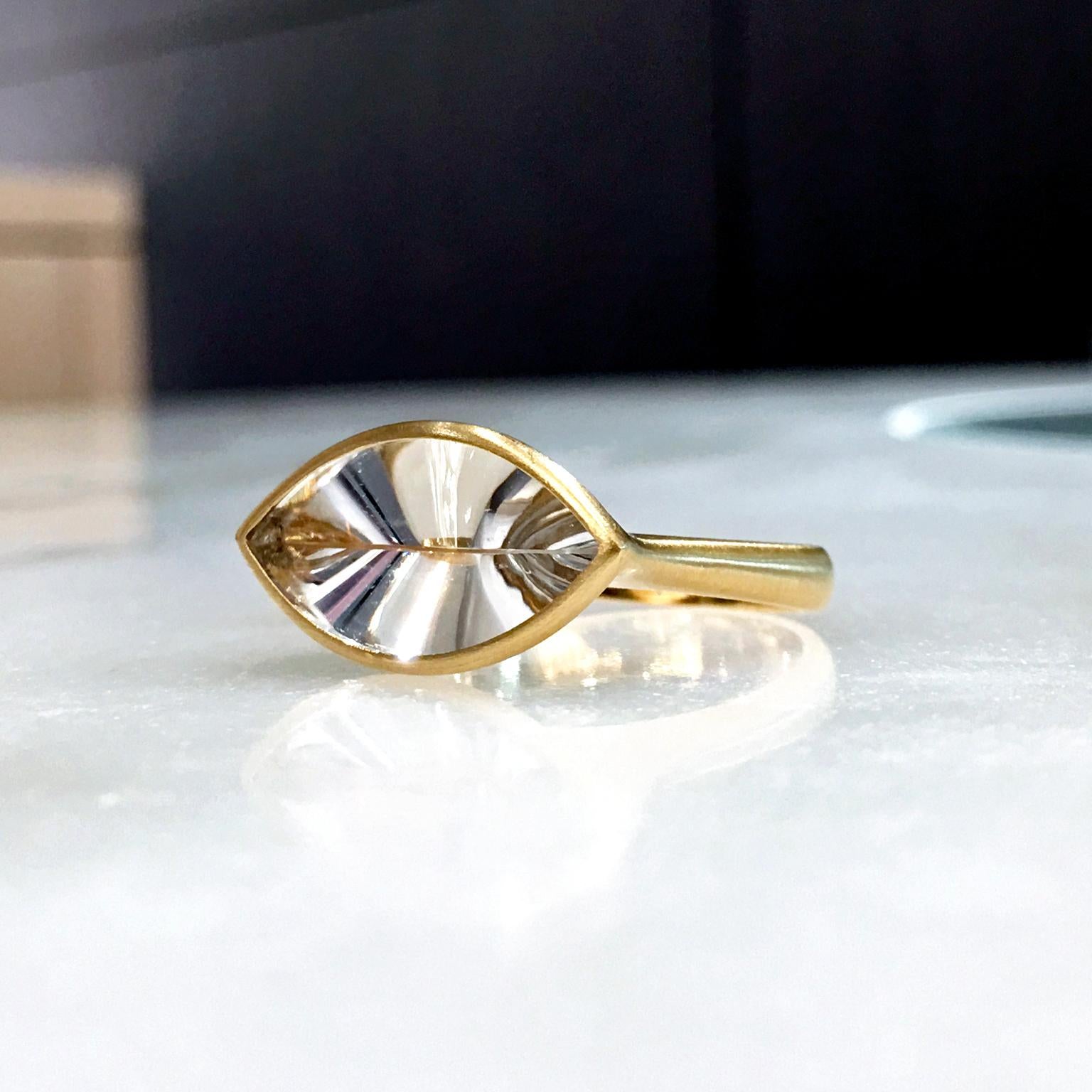 Shine Ring handcrafted by renowned Brazilian jewellery artist Antonio Bernardo in matte-finished 18k yellow gold with a custom-cut prismatic colorless rock crystal quartz bezel-set on a graduated 18k gold shank. Size 7.0 (can be sized).

Stamped 750