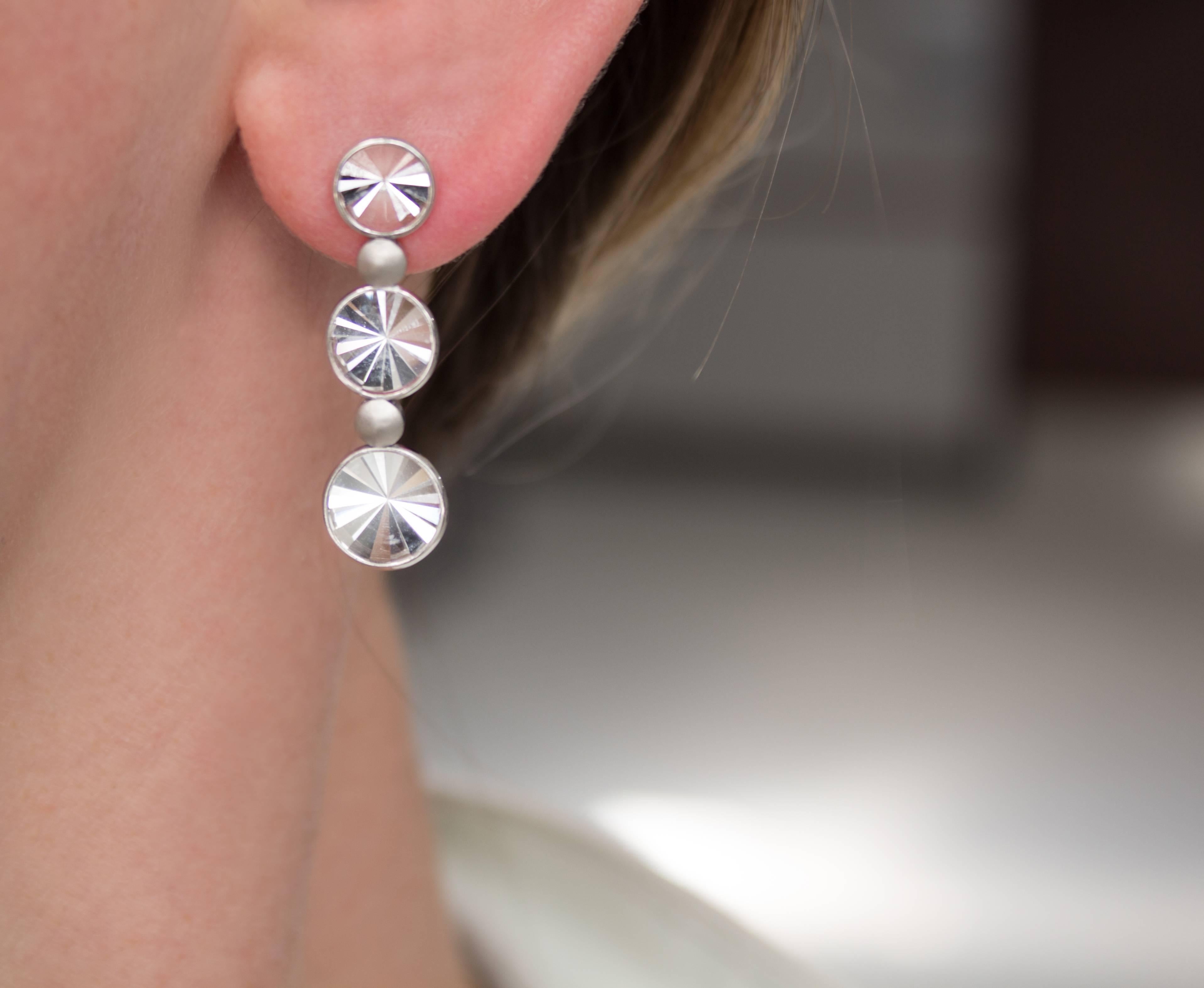 One of a Kind Waterfall Earrings handcrafted in Rio de Janeiro by jewelry maker Antonio Bernardo featuring six signature prism-cut rock crystal elements set in polished 18k white gold and accented by matte-finished 18k white gold disc elements.