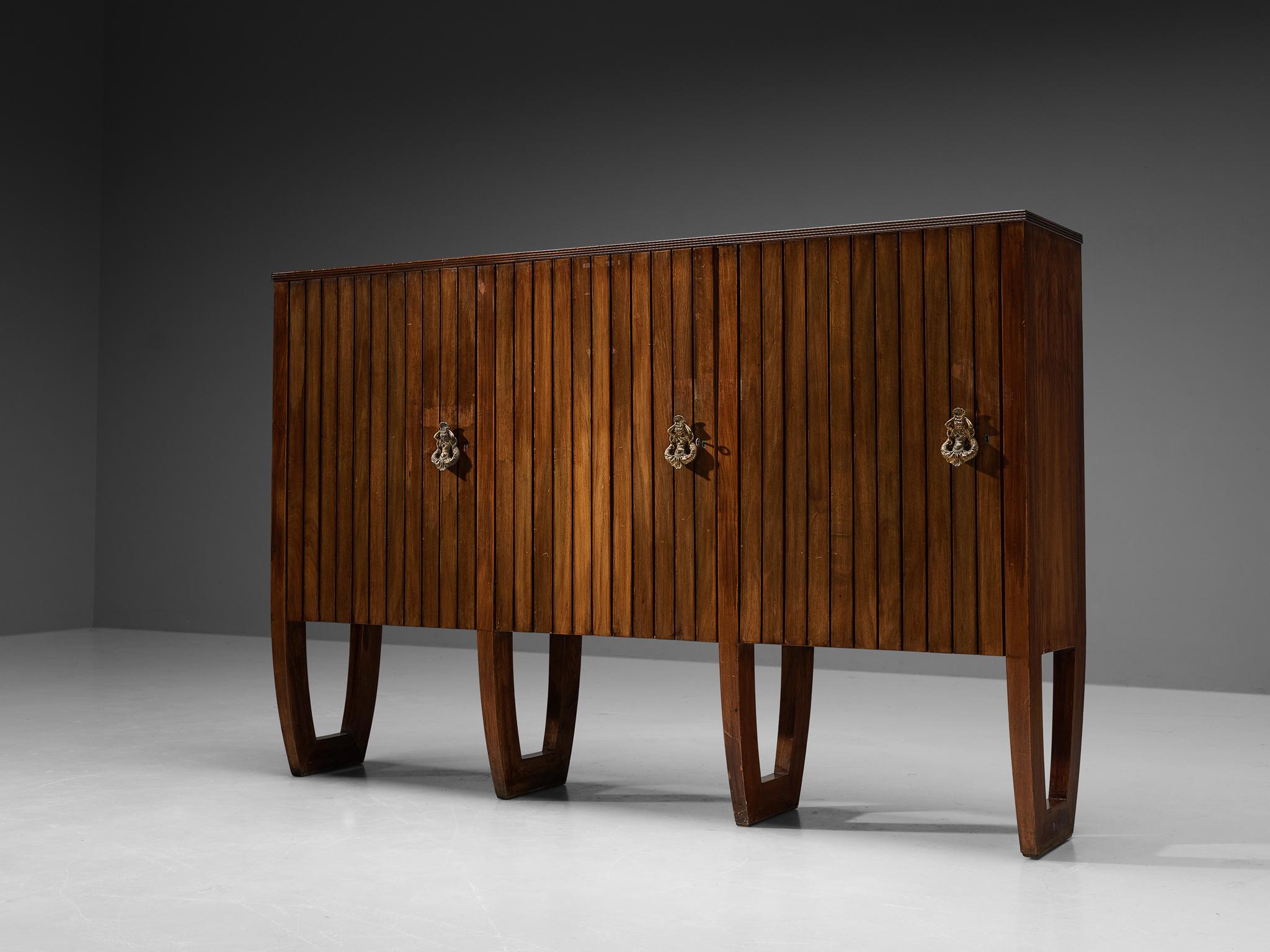 Antonio Cassi Ramelli, sideboard, walnut, brass, Italy, 1940s

This elegant Art Deco case piece is designed by the Italian designer Antonio Cassi Ramelli; a contemporary of Paulo Buffa and whom he collaborated with during the early period of his