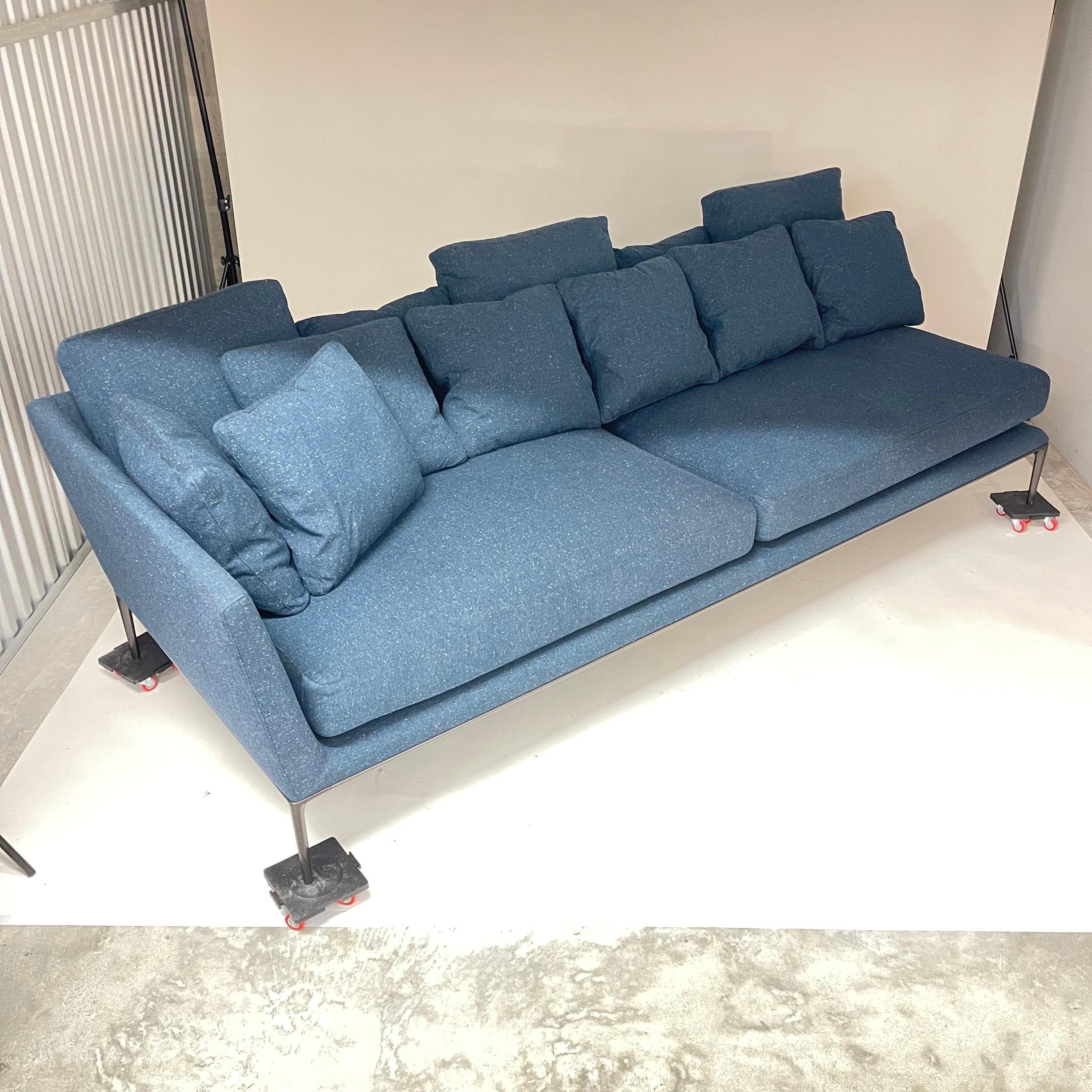 Stunning left arm right facing sofa chaise lounge with two seat cushions and twelve back cushions for extra comfort that can be arranged in numerous combinations. Rendered in blue tweed fabric (Edit 420 dark blue with camel accents) with pewter