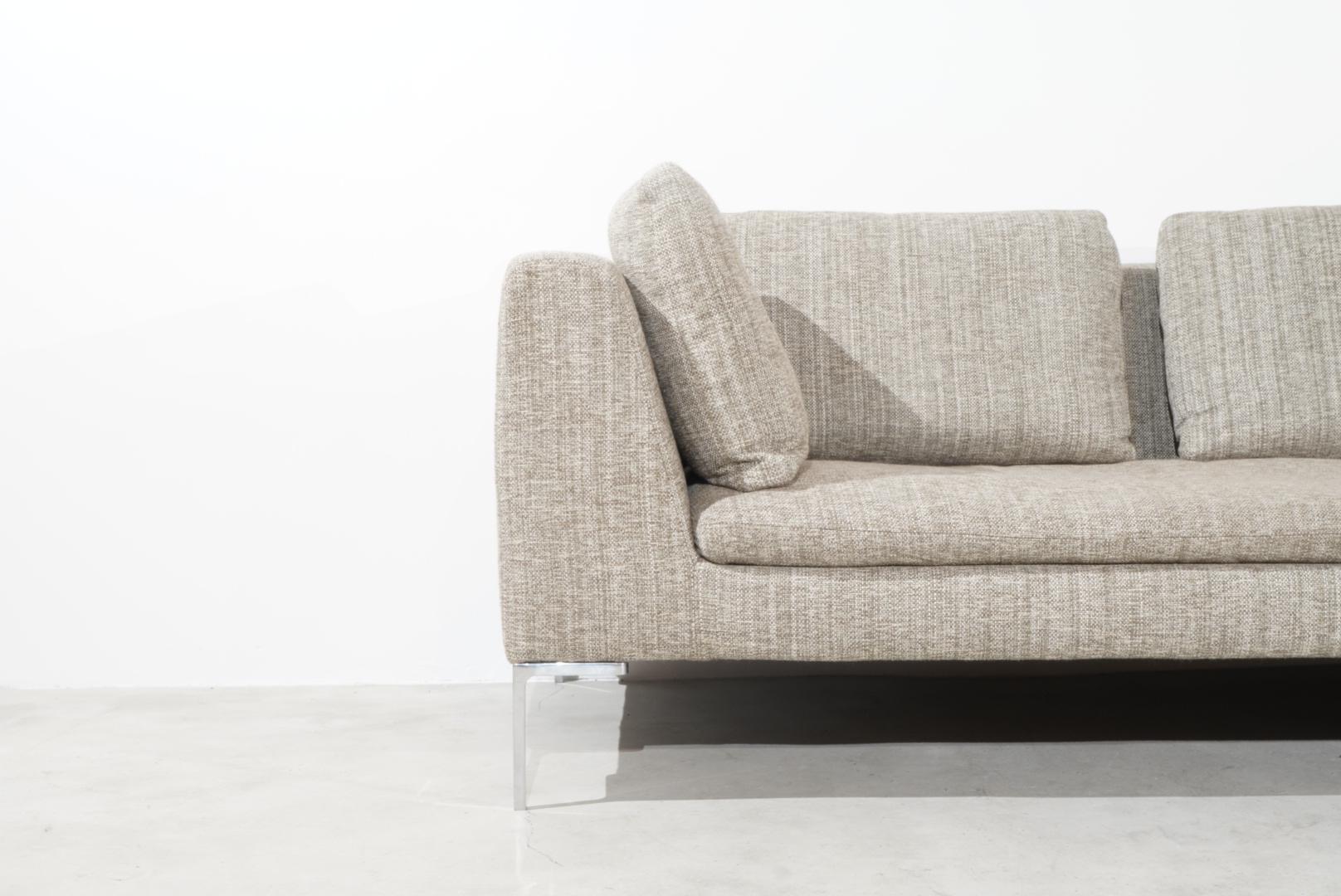 Super comfortable sofa by the famous Designer Antonio Citterio. The two-part sofa was manufactured by Charles for B&B Italia and designed 1997. 
The Sofa has L-shaped aluminium legs, polyurethane foam upholstered frame and beige-coloured textile