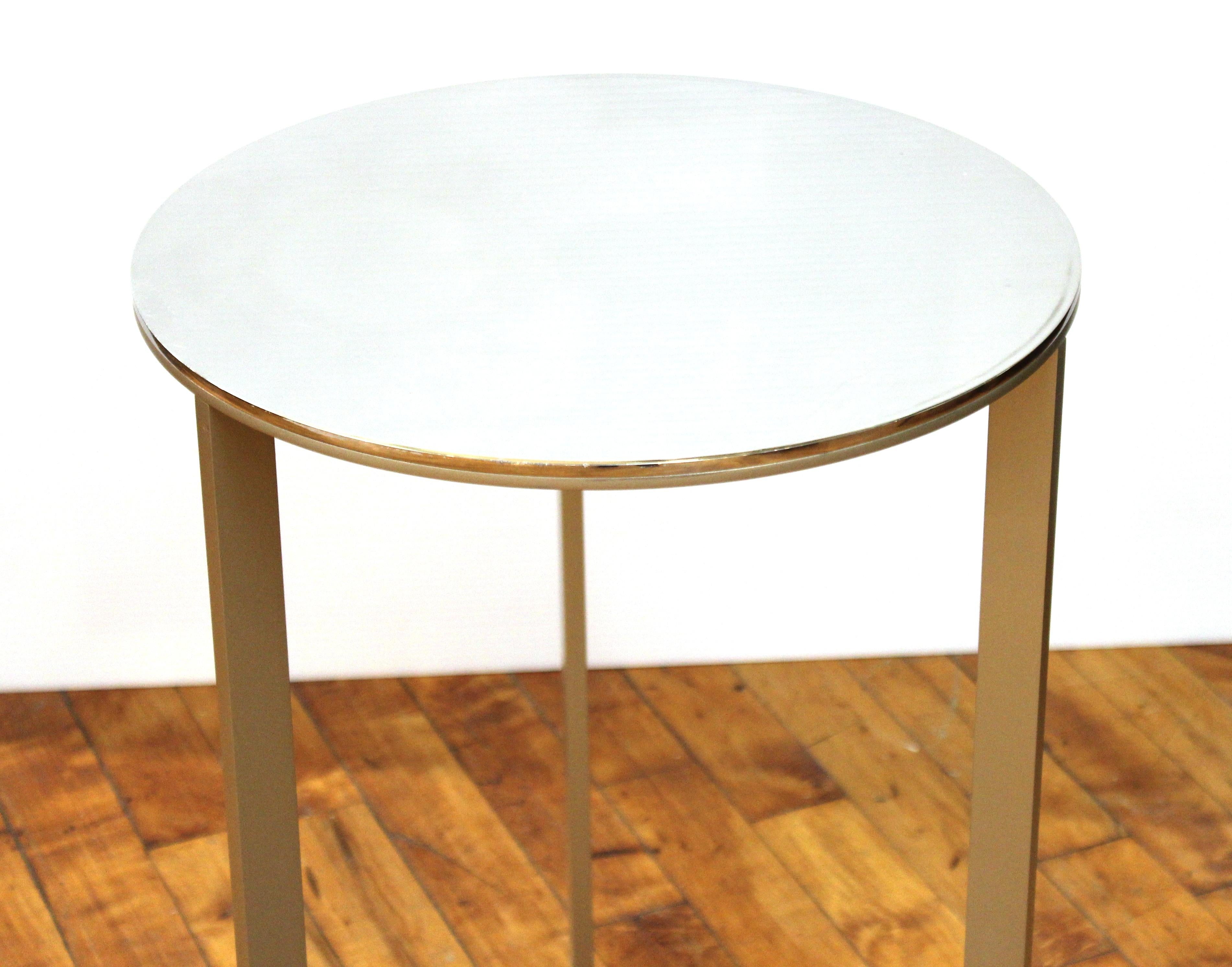 Antonio Citterio for B&B Italia minimalist modern 'Simplice' side table with metal frame and circular mirrored top. Makers tag on the bottom of the mirrored top. In great vintage condition with age-appropriate wear.