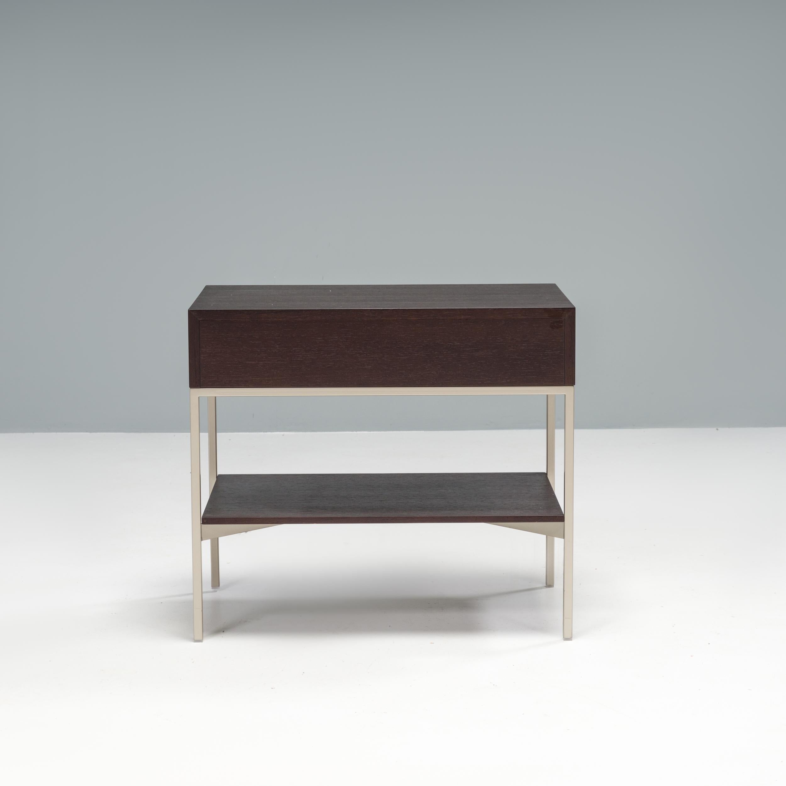 Originally designed by Antonio Citterio for Maxalto in 1996, the Ebe low table is a sleek, classic example of Italian design.

Constructed from grey oak, the compact table sits on a slimline bright chrome frame and features a single drawer unit