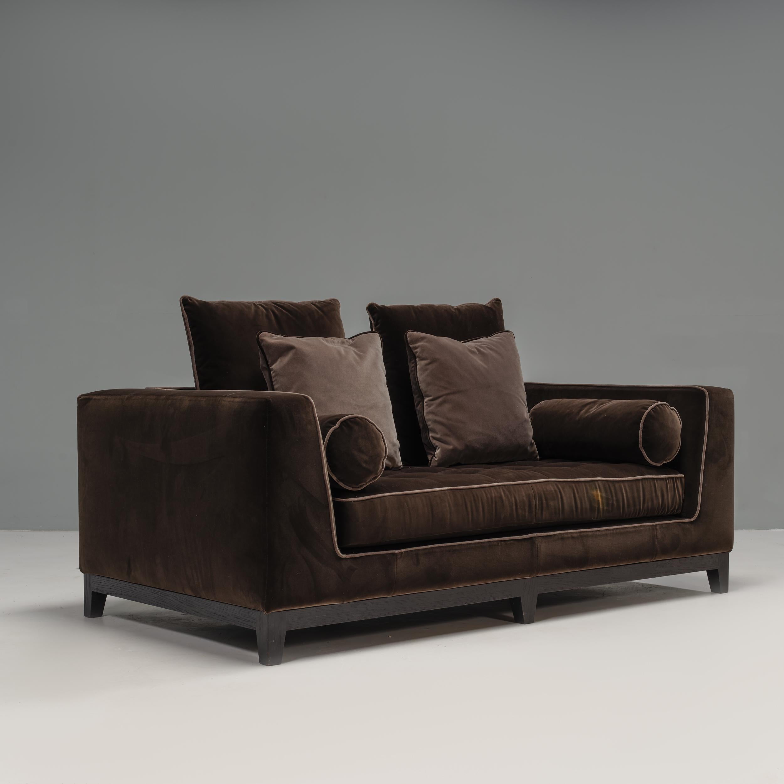 Designed by Antionio Citterio for Maxalto B&B Italia, this two seater sofa seamlessly combines modern and traditional design.

Featuring a square frame sitting on a brushed black oak base, the armrests are integrated into the backrest creating a