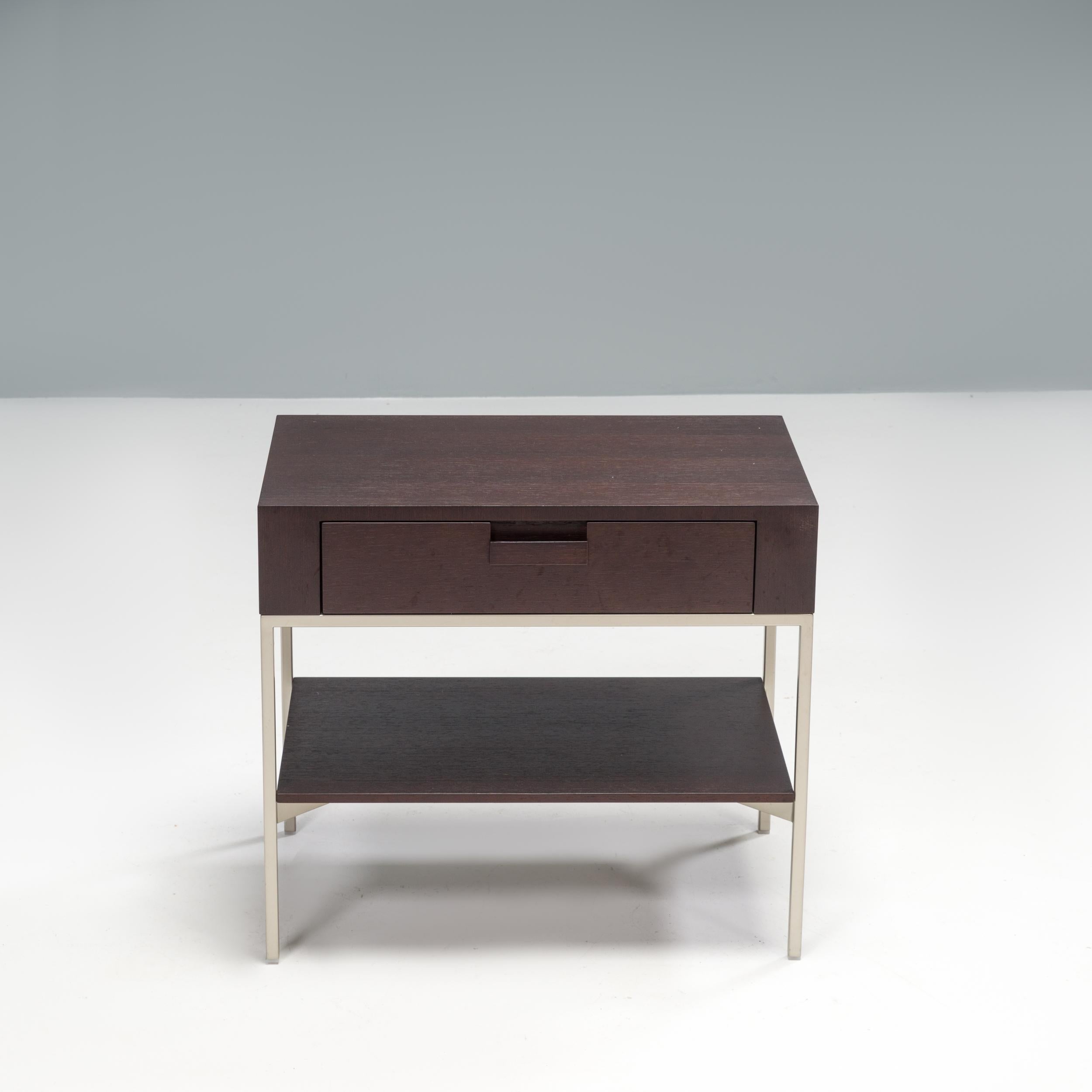 Originally designed by Antonio Citterio for Maxalto in 1996, the Ebe low table is a sleek, classic example of Italian design.

Constructed from grey oak, the table sits on a slimline bright chrome frame and features a single drawer unit with an