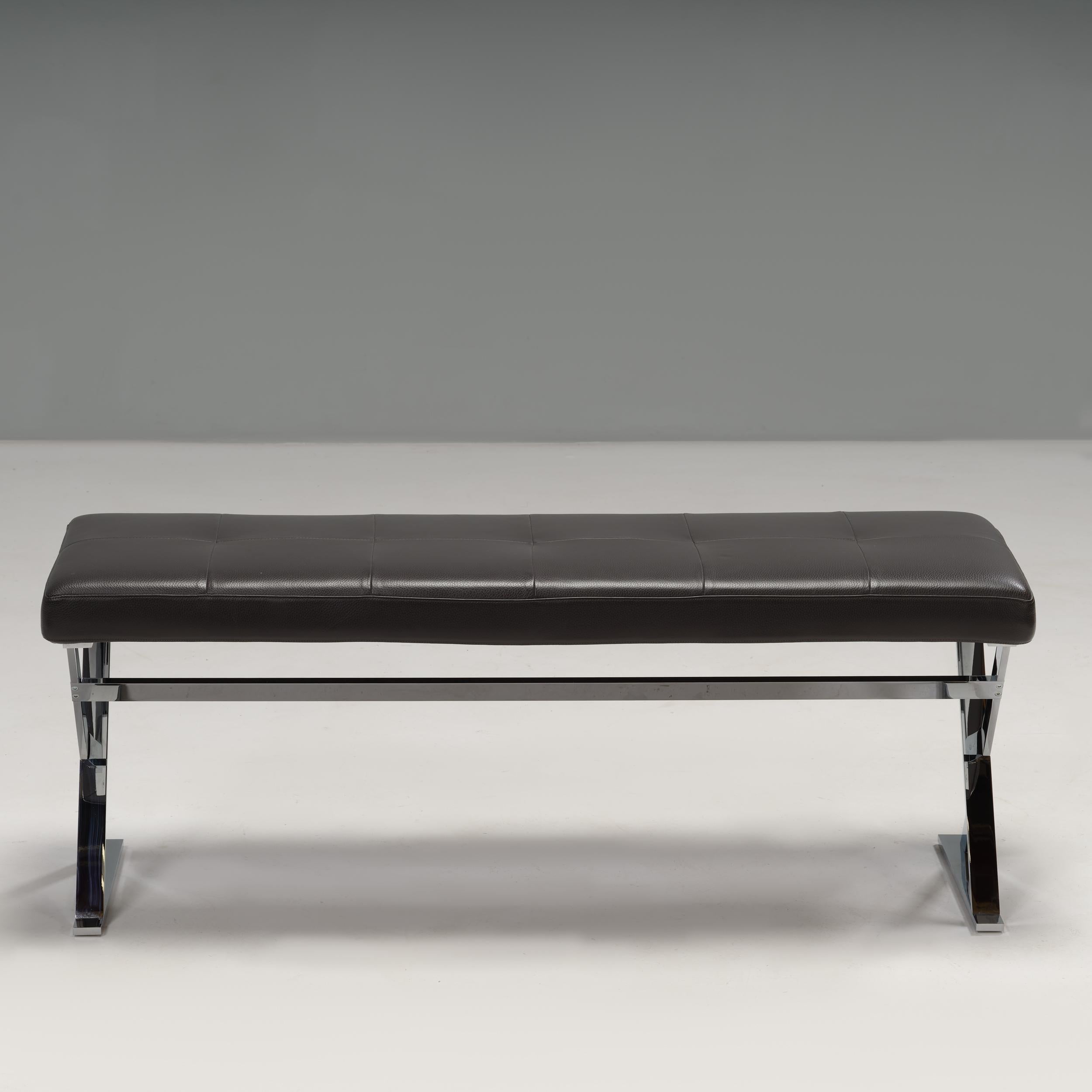Designed by Antonio Citterio for Maxalto, the Pathos bench is a versatile design.

Constructed from a bright chrome cross-frame base, the bench features a seat cushion upholstered in black leather with a quilted detail.

Practical and chic, this