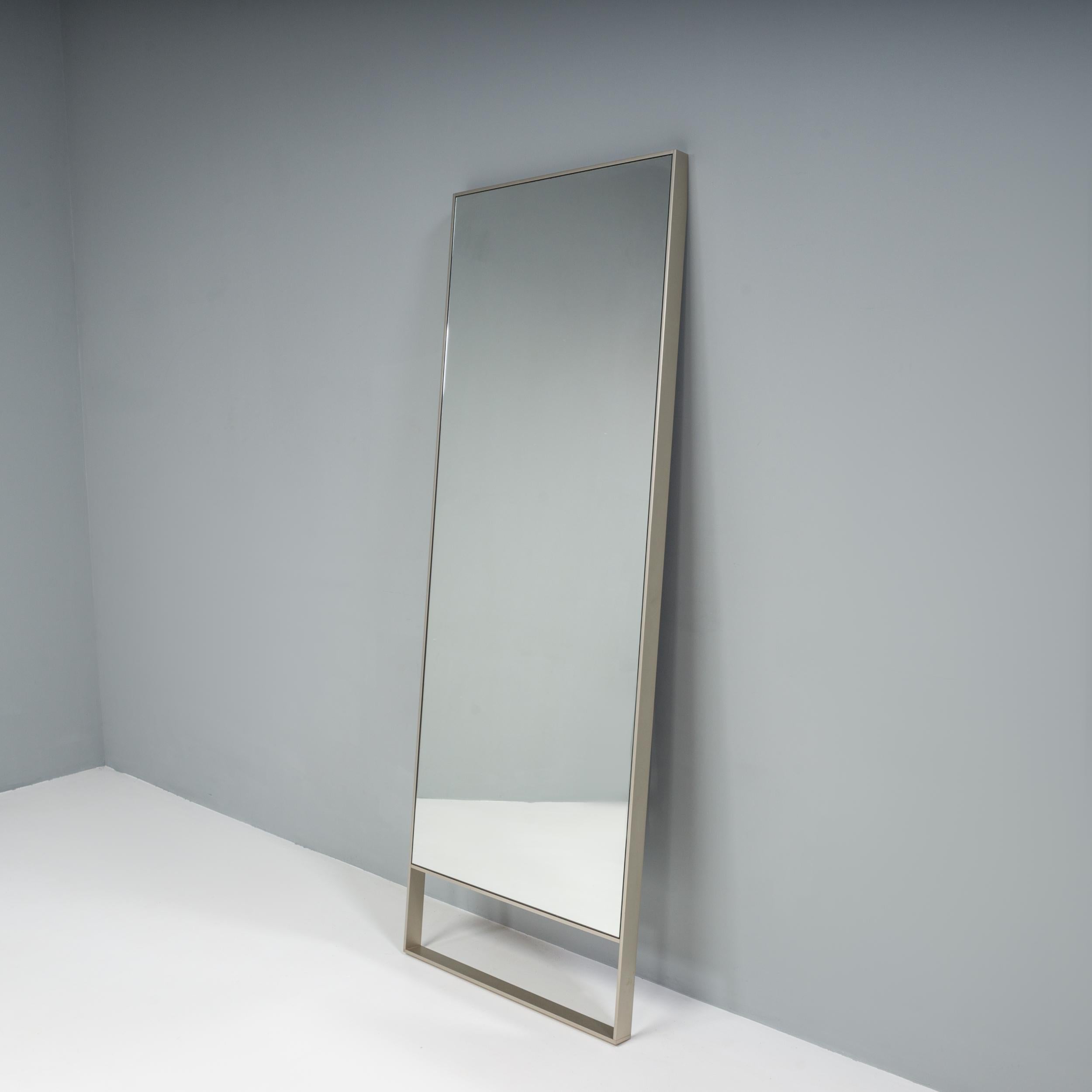 Originally designed by Antonio Citterio for Maxalto in 2001, the Psiche wall mirror is both elegant and refined.

The tall, free-standing mirror has an angular frame in a bright chromed finish, while the angled top allows it to lean against a