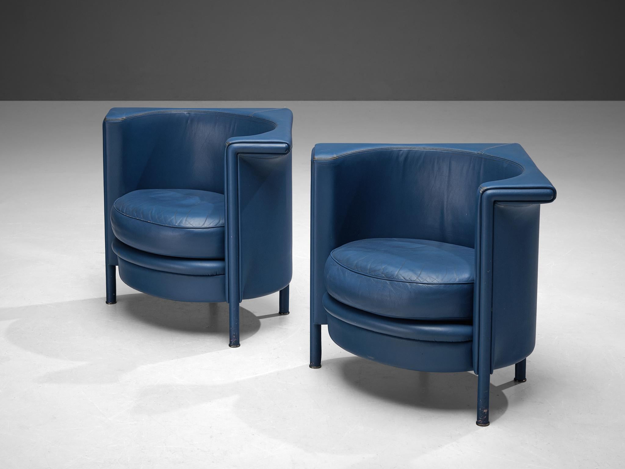 Antonio Citterio for Moroso, lounge chairs, leather, metal, wood, Italy, 1980s.

Interestingly shaped blue leather armchairs by Italian designer Antonio Citterio for manufacturer Moroso. The base and seat of the chair are in formed in a round shape,