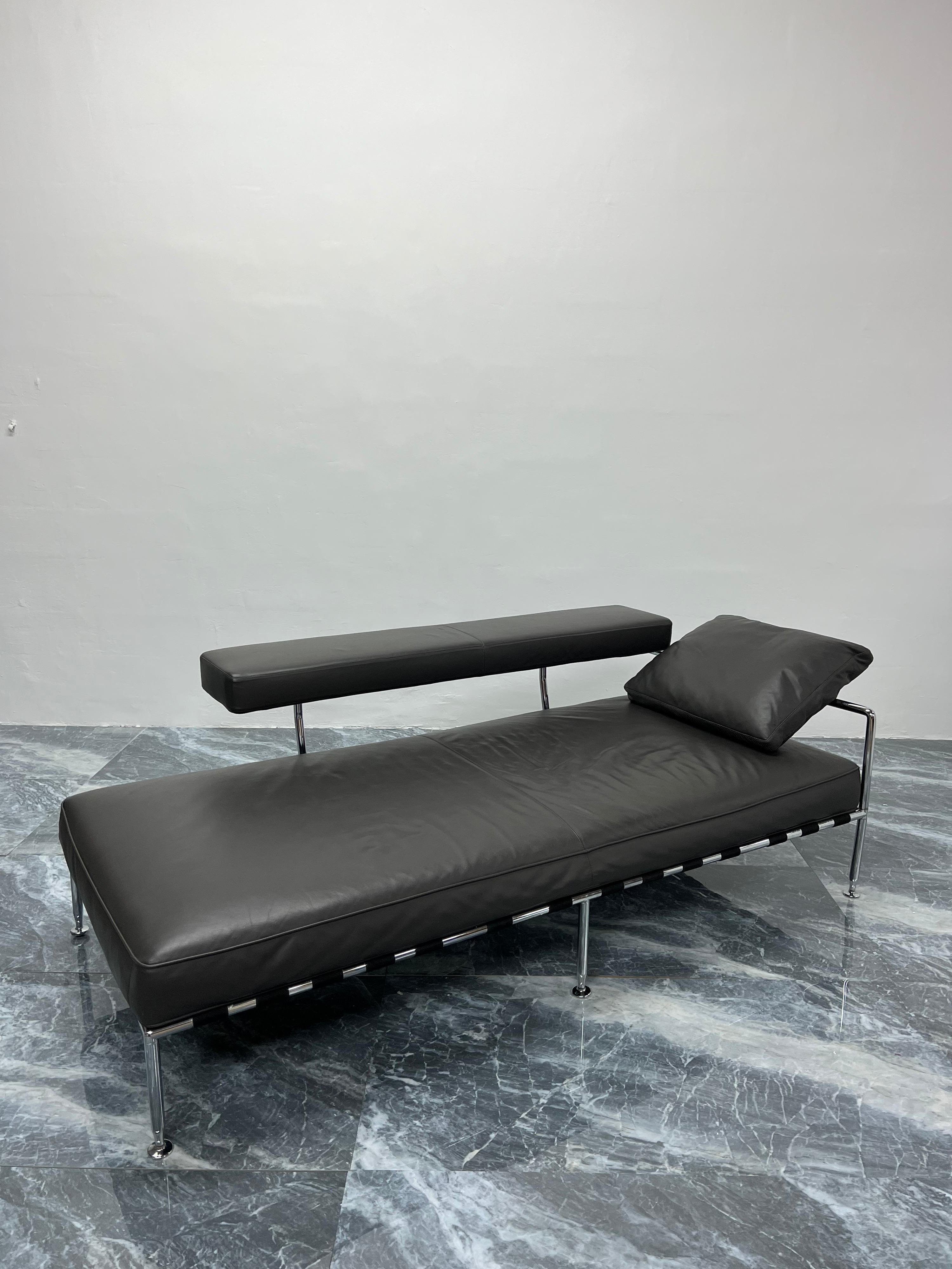 Charcoal gray leather and tubular chrome daybed or chaise lounge designed by Antonio Citterio and produced by B&B Italia. The leather arm rotates outward to make more room on the bed.