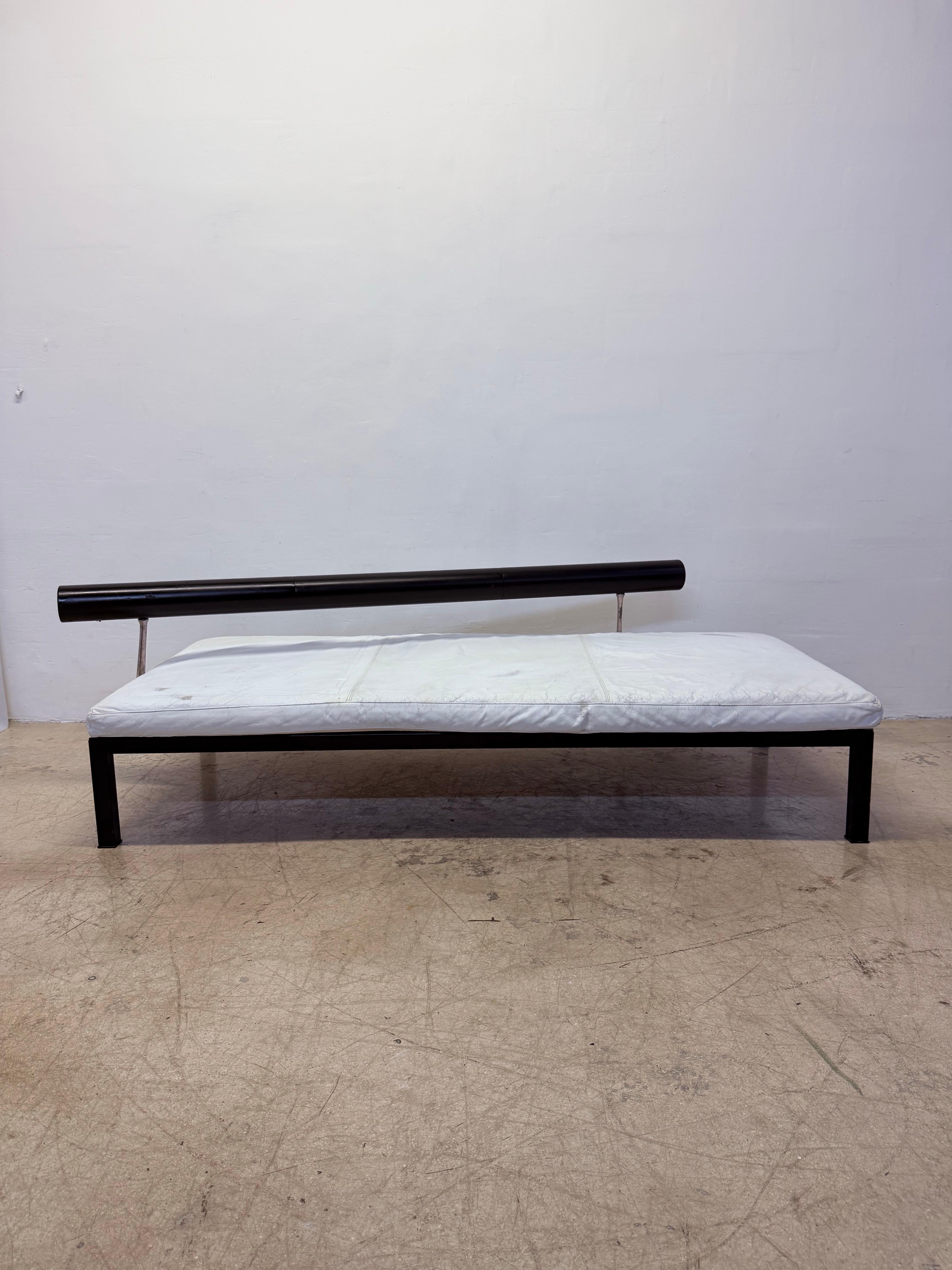 Distressed white leather daybed on a black steel frame with black leather wrapped angled backrest designed by Antonio Citterio for B&B Italia, 1980s.