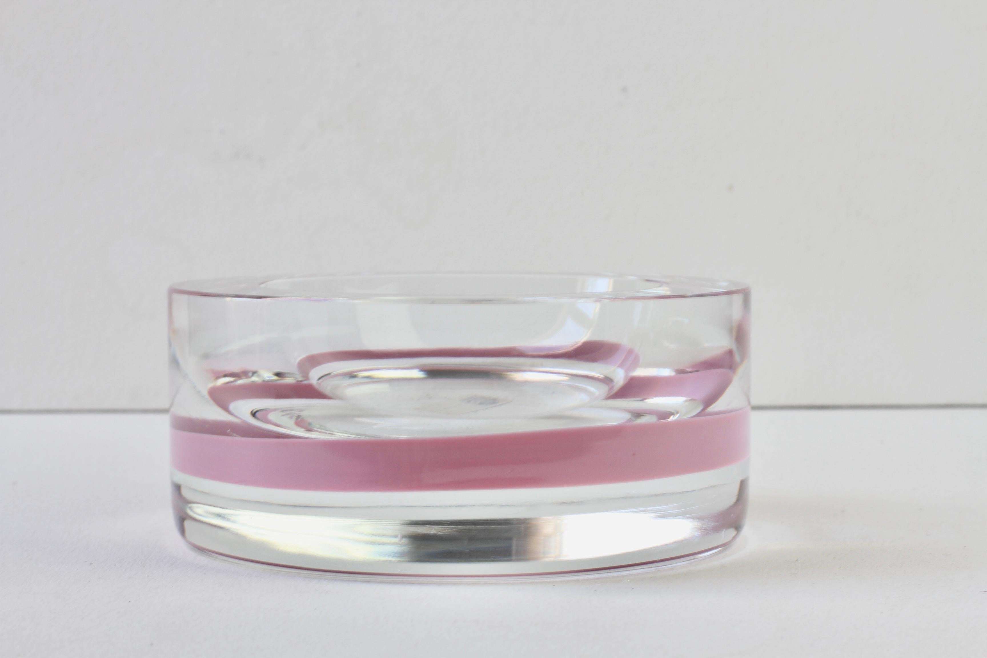 A very large and heavy vintage Mid-Century Modern Italian Murano glass bowl or ashtray, made in Italy circa 1965-1975 by Antonio da Ros for Cenedese. This large, heavy piece of glass features a circular glass pink band running around the