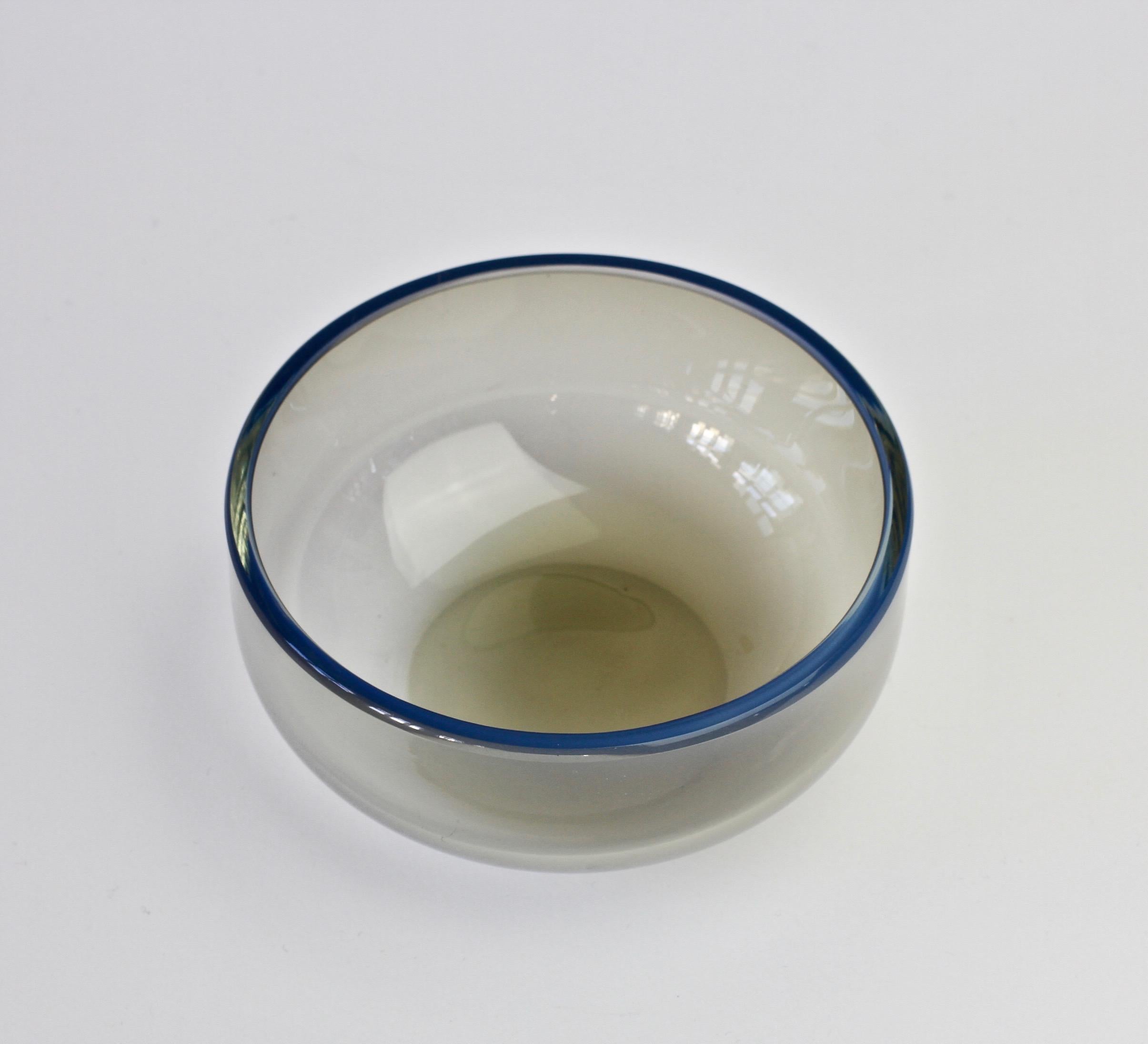 Single midcentury, vintage 'Opalino' Murano glass bowl designed by Antonio da Ros (1936-2012) for Cenedese, circa 1970-1990. Wonderful translucent color of 'smoked mushroom' gray (grey) with a secondary layer of blue glass. Simplistic yet elegant