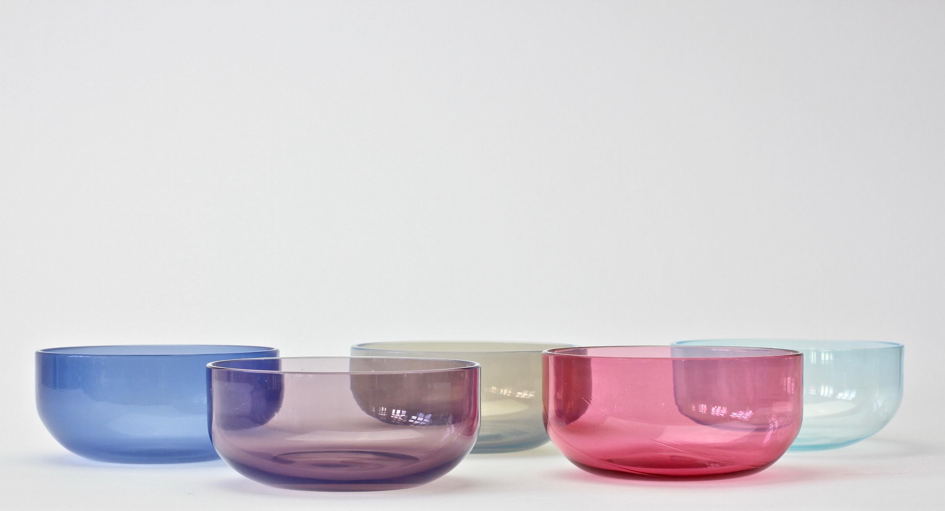 One of four sets or ensemble of five 'Opalino' Murano glass bowls designed by Antonio da Ros (1936-2012) for Cenedese, circa 1970-1990. Wonderful translucent colors of vibrant blues, aubergine and pink. Simplistic yet elegant forms - almost