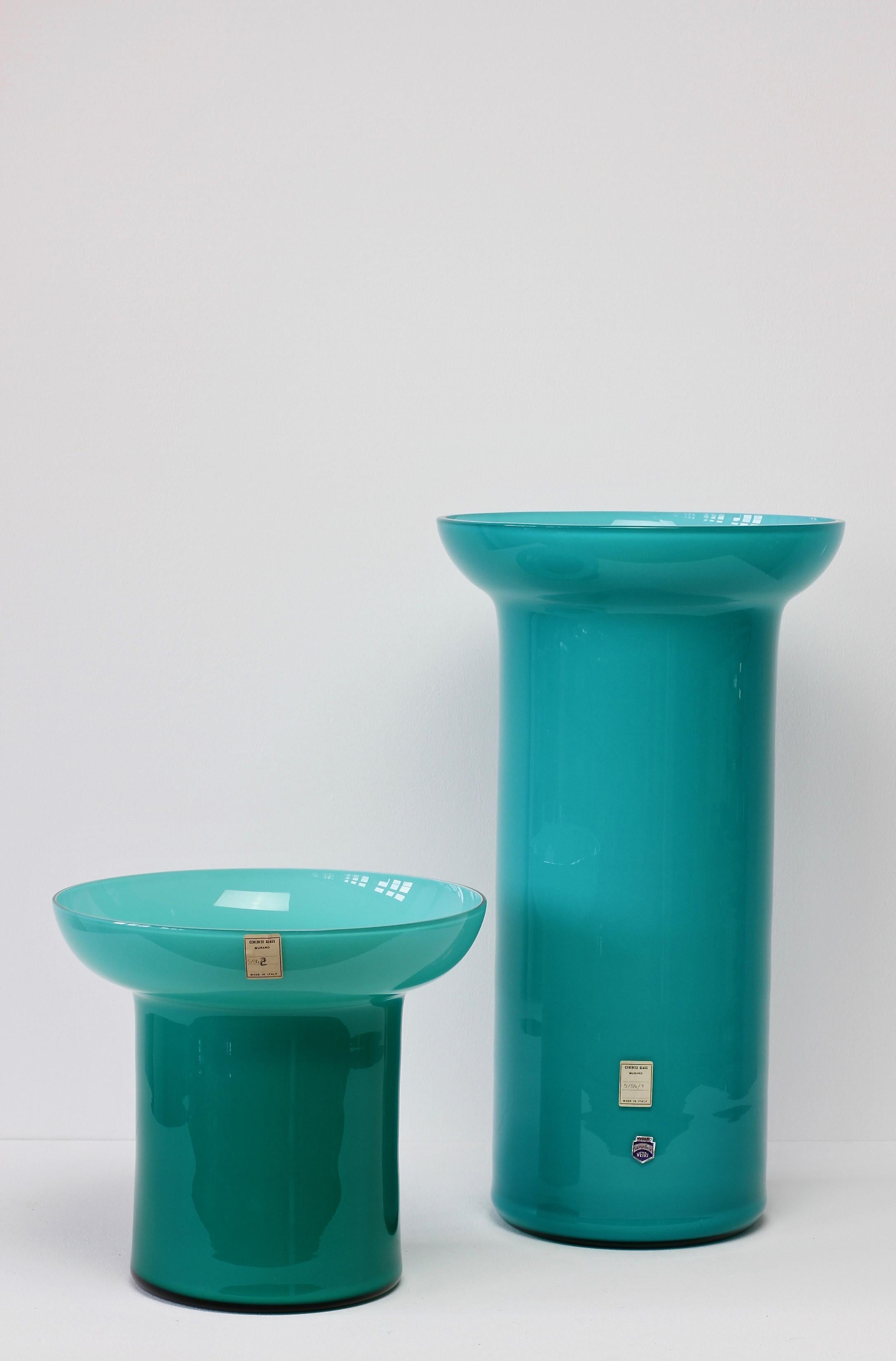 Monumental large pair of vases by Cenedese glass of Murano, Italy circa 1984. Particularly striking is the elegant form and bold, petrol blue/turquoise color/colour.

Original paper label on the taller vase reads - 5/84/1 
Original paper label on