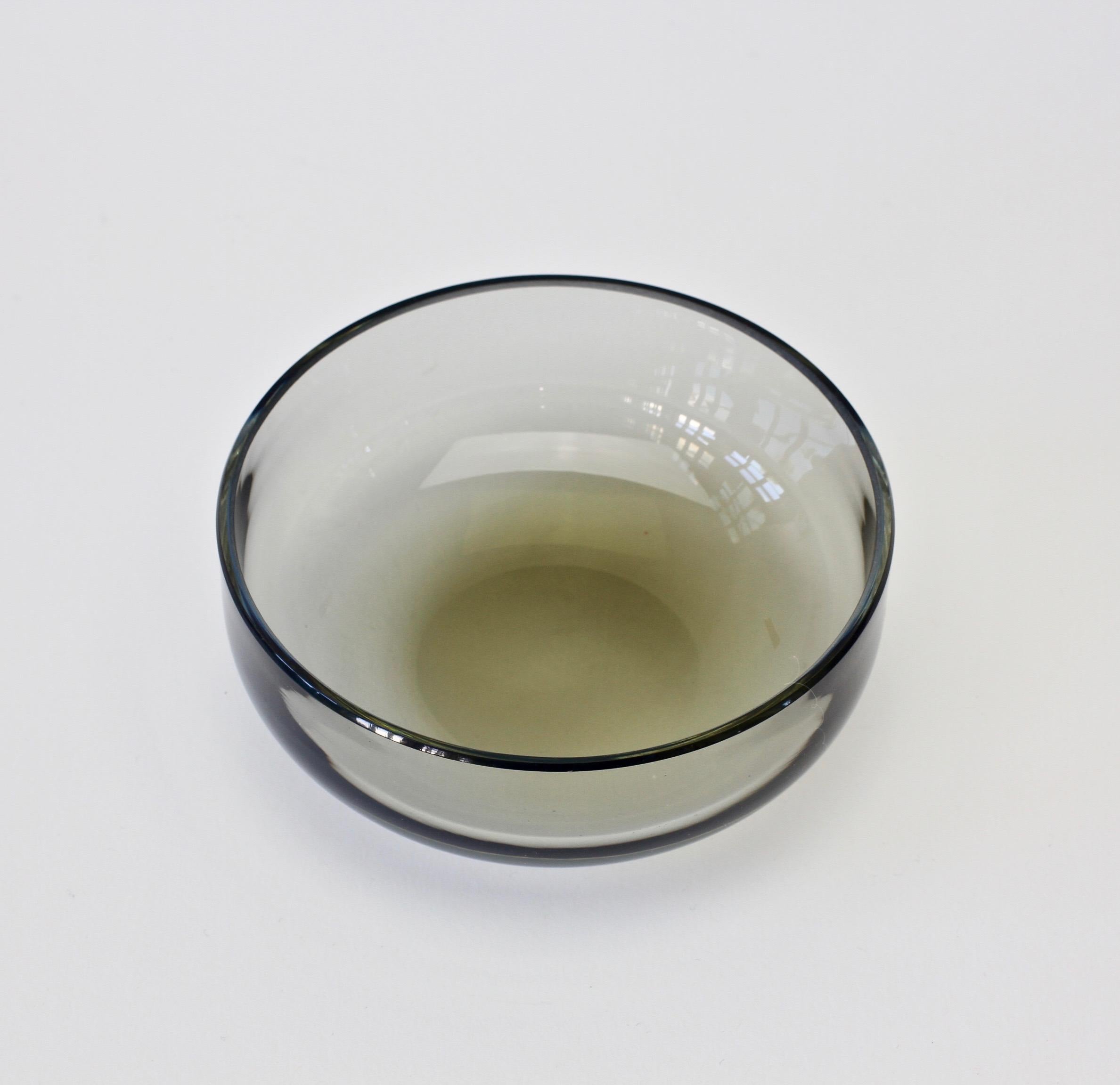 Single midcentury, vintage Murano glass bowl designed by Antonio da Ros (1936-2012) for Cenedese, circa 1970-1990. Wonderful translucent color of smoked gray (grey) toned glass. Simplistic yet elegant form - almost futuristic. A very beautiful small