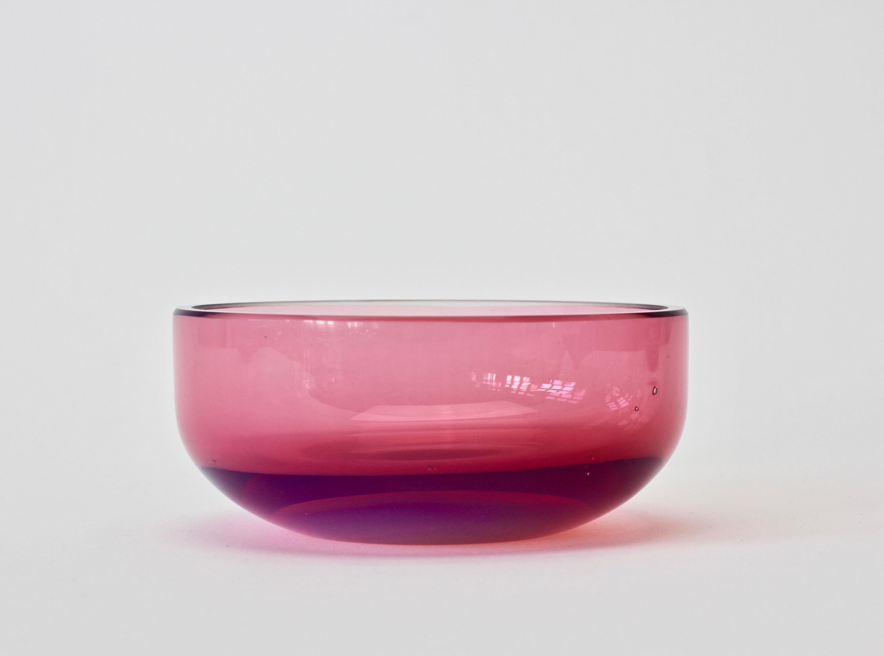 Single midcentury, vintage 'Opalino' Murano glass bowl designed by Antonio da Ros (1936-2012) for Cenedese, circa 1970-1990. Wonderful translucent color of vivid pink with a secondary layer of purple/lilac glass. Simplistic yet elegant form - almost