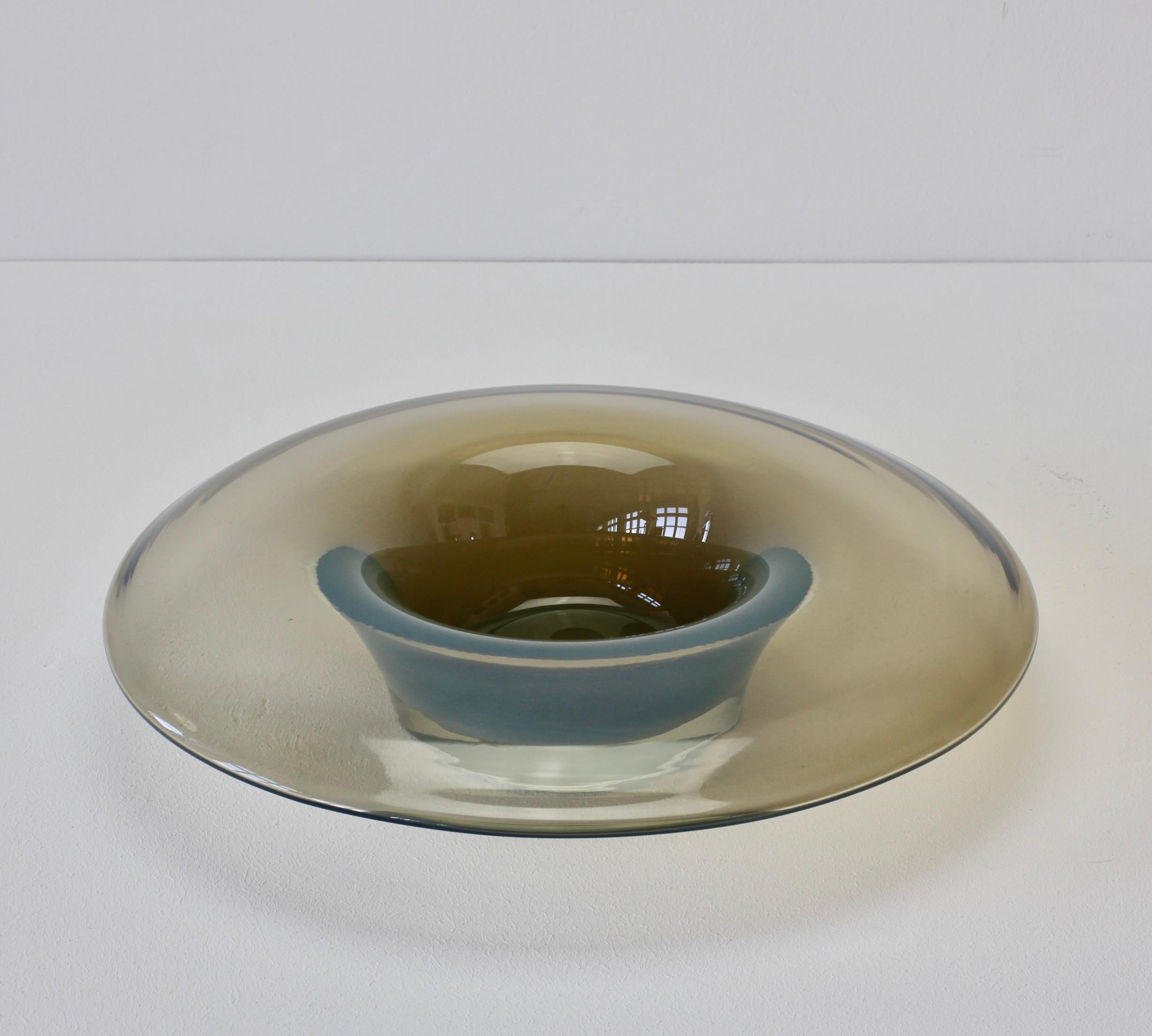 Italian Murano glass 'Opalino' serving or dipping bowl by Antonio da Ros for Cenedese, Italy, circa 1970-1990. Wonderful translucent color of smoked grey. Simplistic yet elegant form, almost futuristic. Very fun to dine with this rare piece of