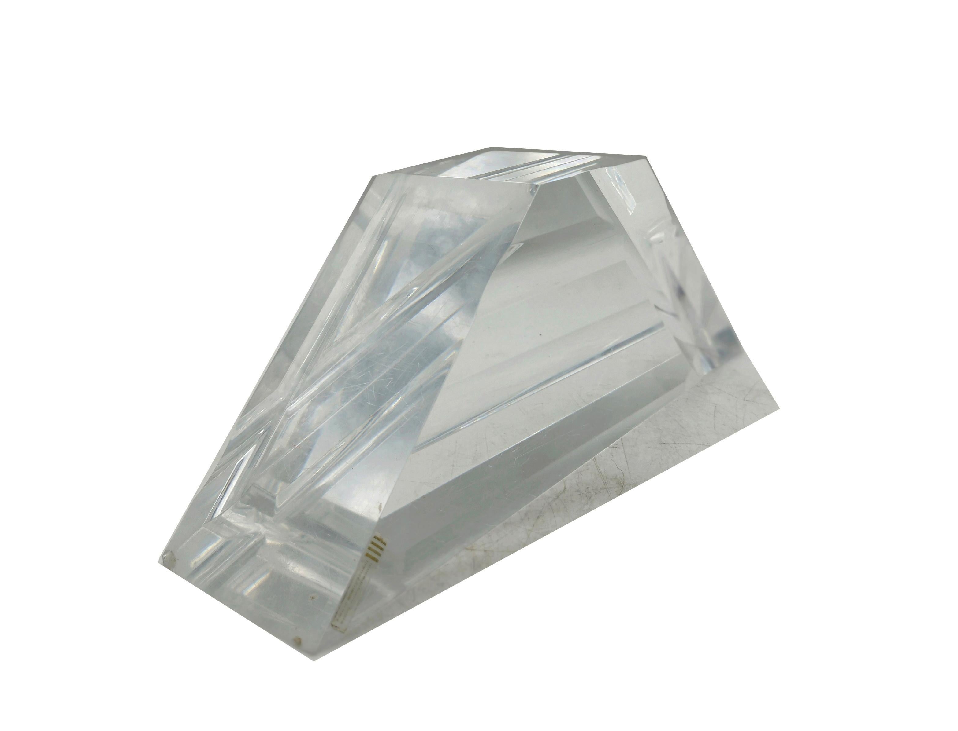 Stunning geometric pyramid-shaped lucite sculpture/paperweight designed by Felice Antonio Botta, Florence, Italy. Elegant modernist form from the 1970s with incredible carved design. Crystalline lucite with extra thick shape. Original label is still