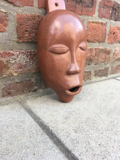 Maschera in terracotta smaltata di Antonio Lampecco, 1960 circa