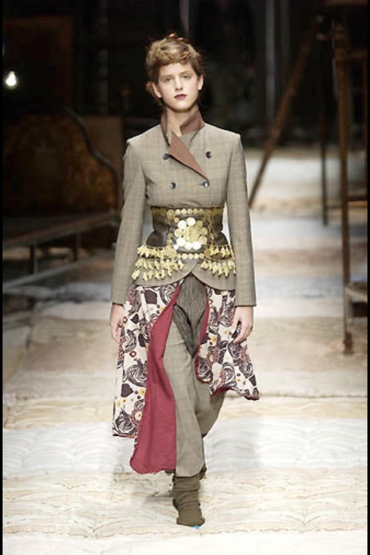 BRAND : ANTONIO MARRAS

DESIGNER : ANTONIO MARRAS

YEAR/DECADE : FALL/WINTER 2002

SIZE : 42 FITS M

MADE IN : ITALY

COMPOSITION : 100% LEATHER ; METAL

CONDITION : GOOD

NOTE : SEEN ON THE RUNWAY IN 2 COLORS

Mannequin is a size S.