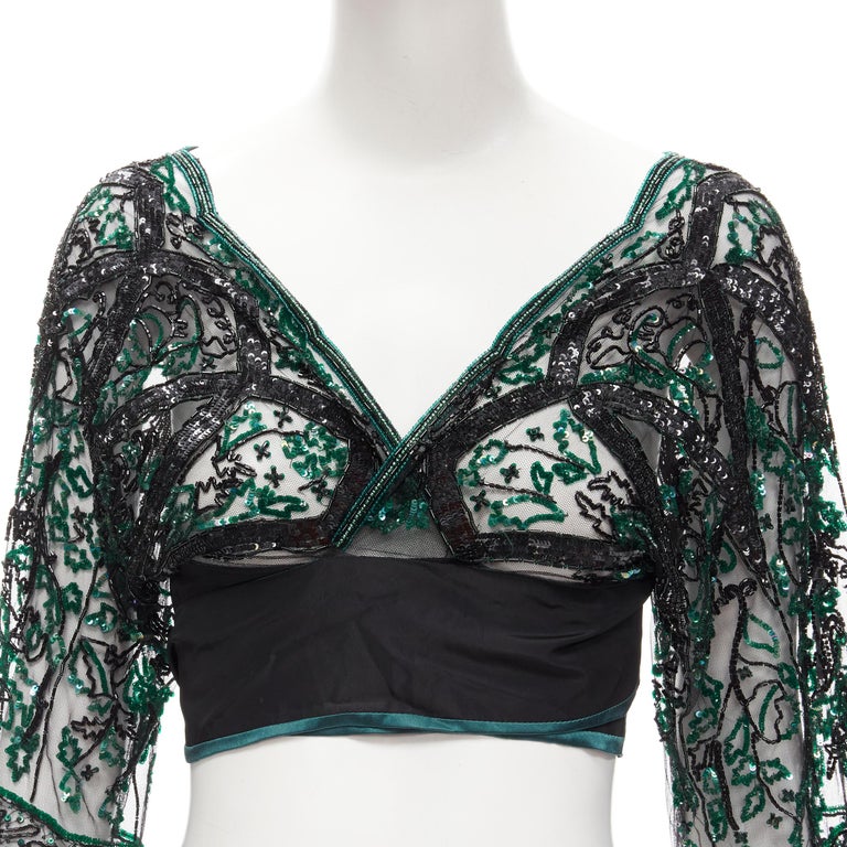 ANTONIO MARRAS green black fully sequins bead embellished wrap sheer top
Brand: Antonio Marras
Color: Green
Pattern: Floral
Closure: Wrap Tie
Extra Detail: Sheer mesh upper with green and black sequins and bead embellishment throughout. Silk wrap
