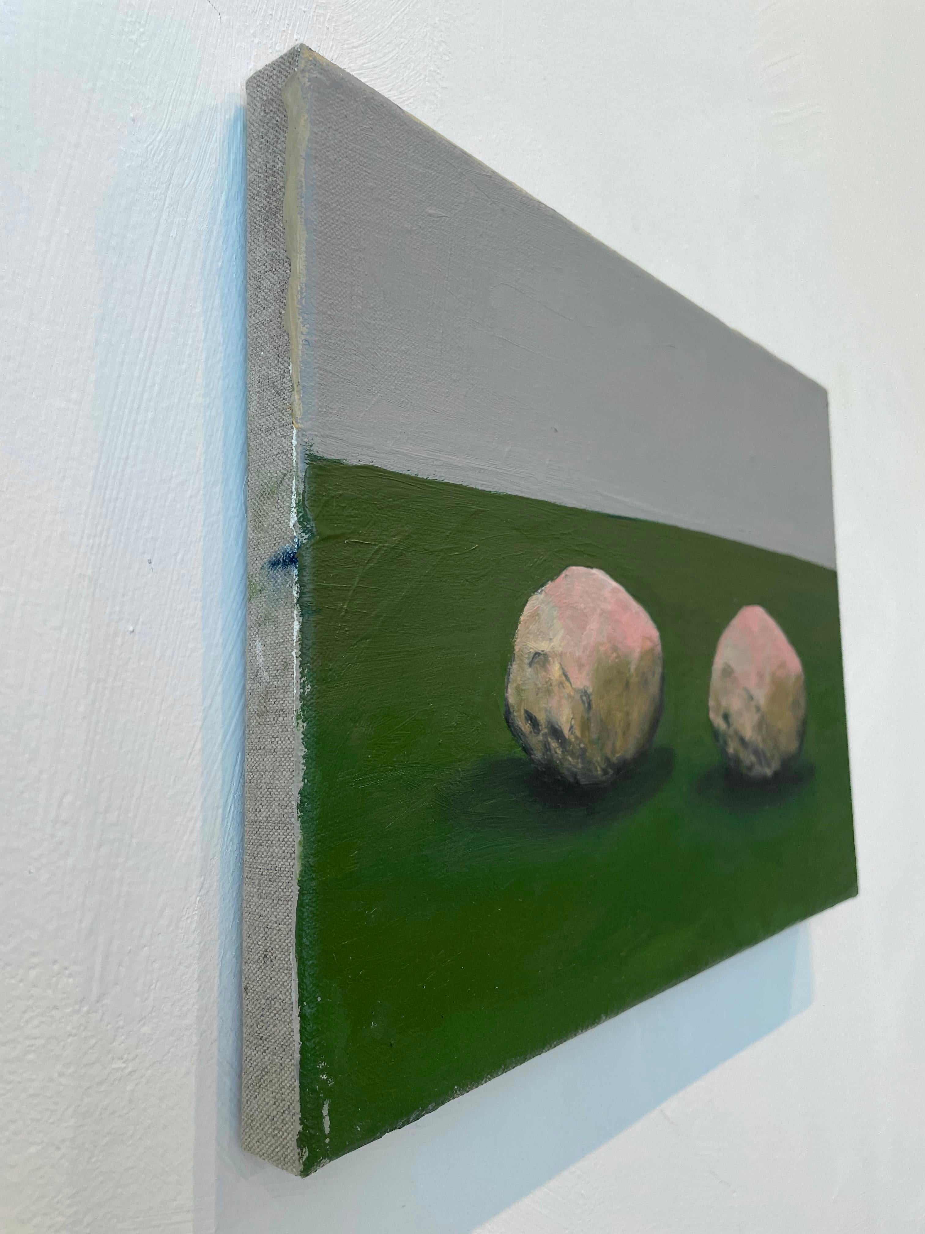 The choice of pink for the stones is deliberate, emphasizing that this is not a naturalistic depiction. Ortega begins his paintings on a magenta base—a color that does not exist naturally and was chemically developed in the late 19th century. His