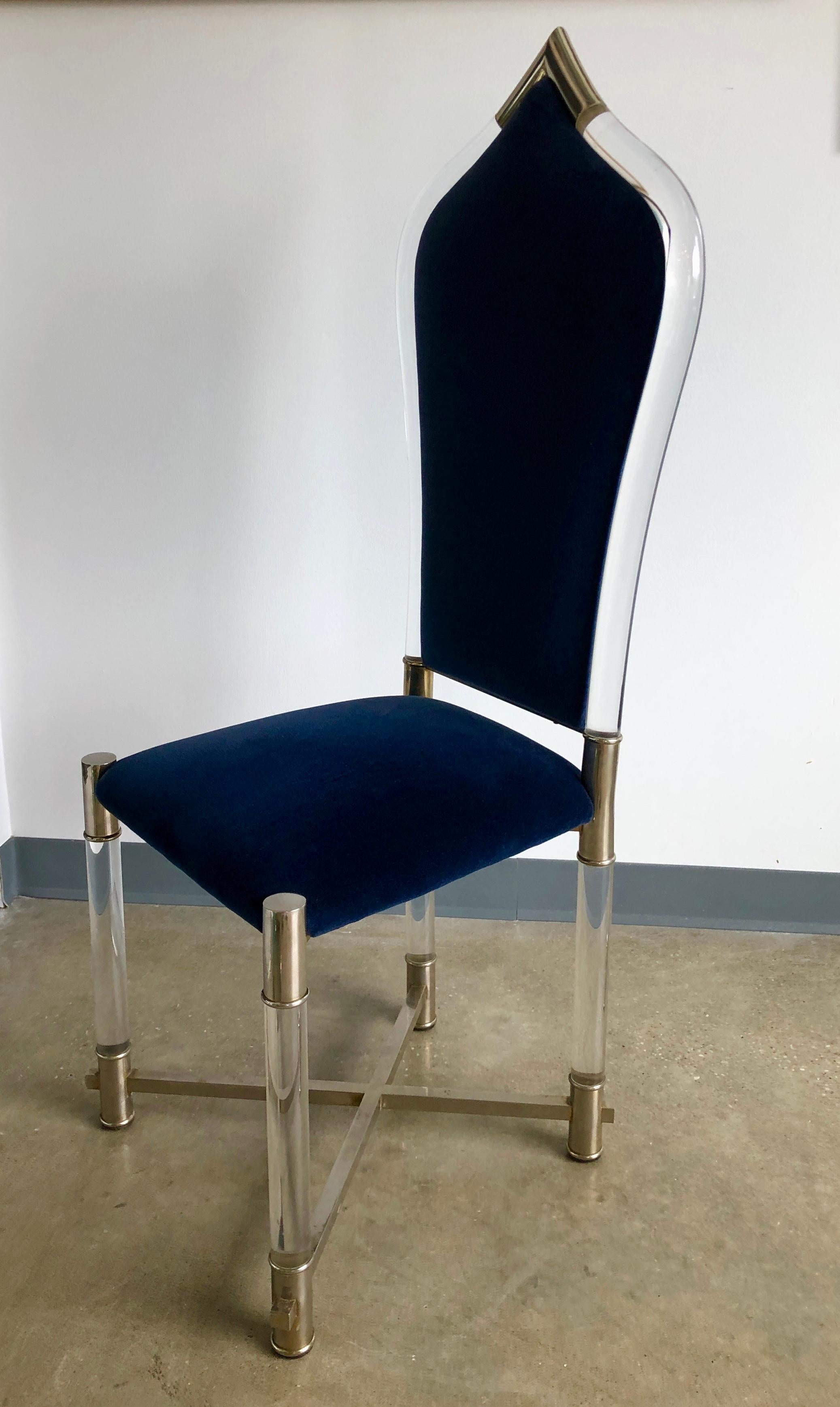 Offered is a Mid-Century Modern Italian and very special piece from Antonio Pavia. The accent high back chair with a Lucite frame, clear lacquered stainless steel and new sapphire blue velvet is a nod to the style of Moorish architecture. This chair