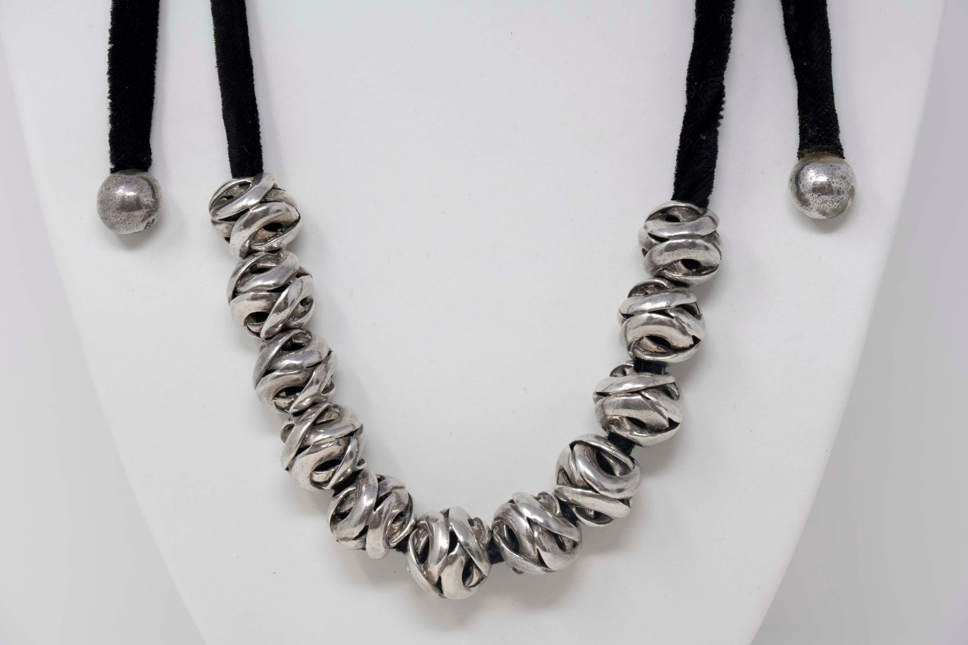 Modernist Mexican Antonio Pineda necklace stamped 970 silver mark with a velvet cord and 11 spheres. Pineda crown mark late 1950. The necklace measures 31 inches long, including the two smaller balls at the end. Weighs 110 grams. In good condition,
